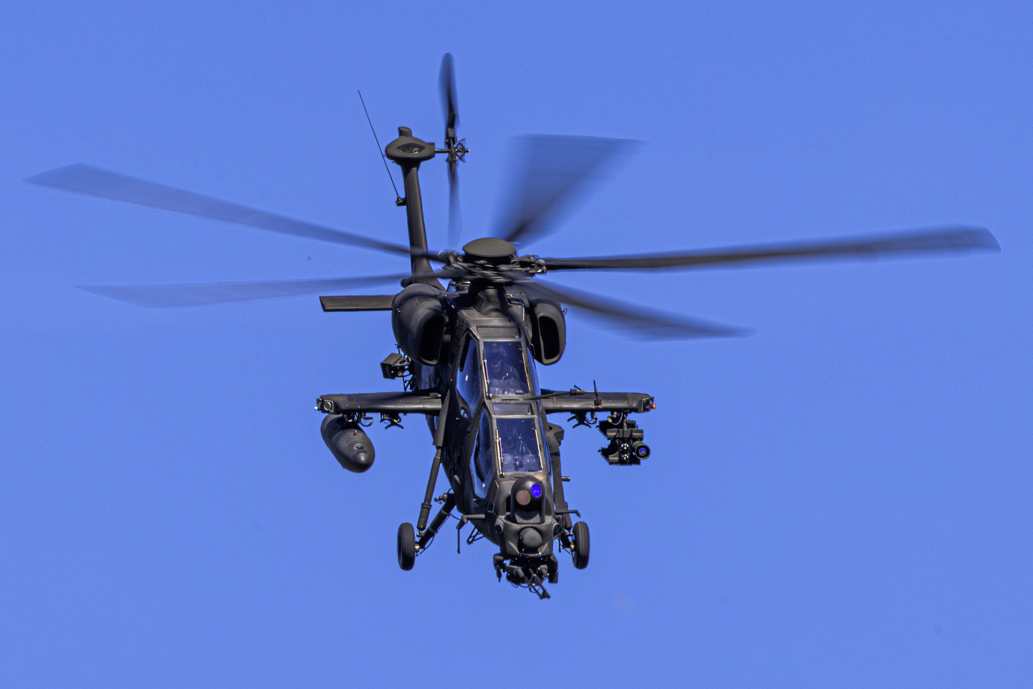An Italian Army A129D Mangusta during a simulated escort mission for vehicles and troops patrolling a restricted area; thanks to its turret, it can see for several kilometers, ensuring excellent security for personnel on the ground.