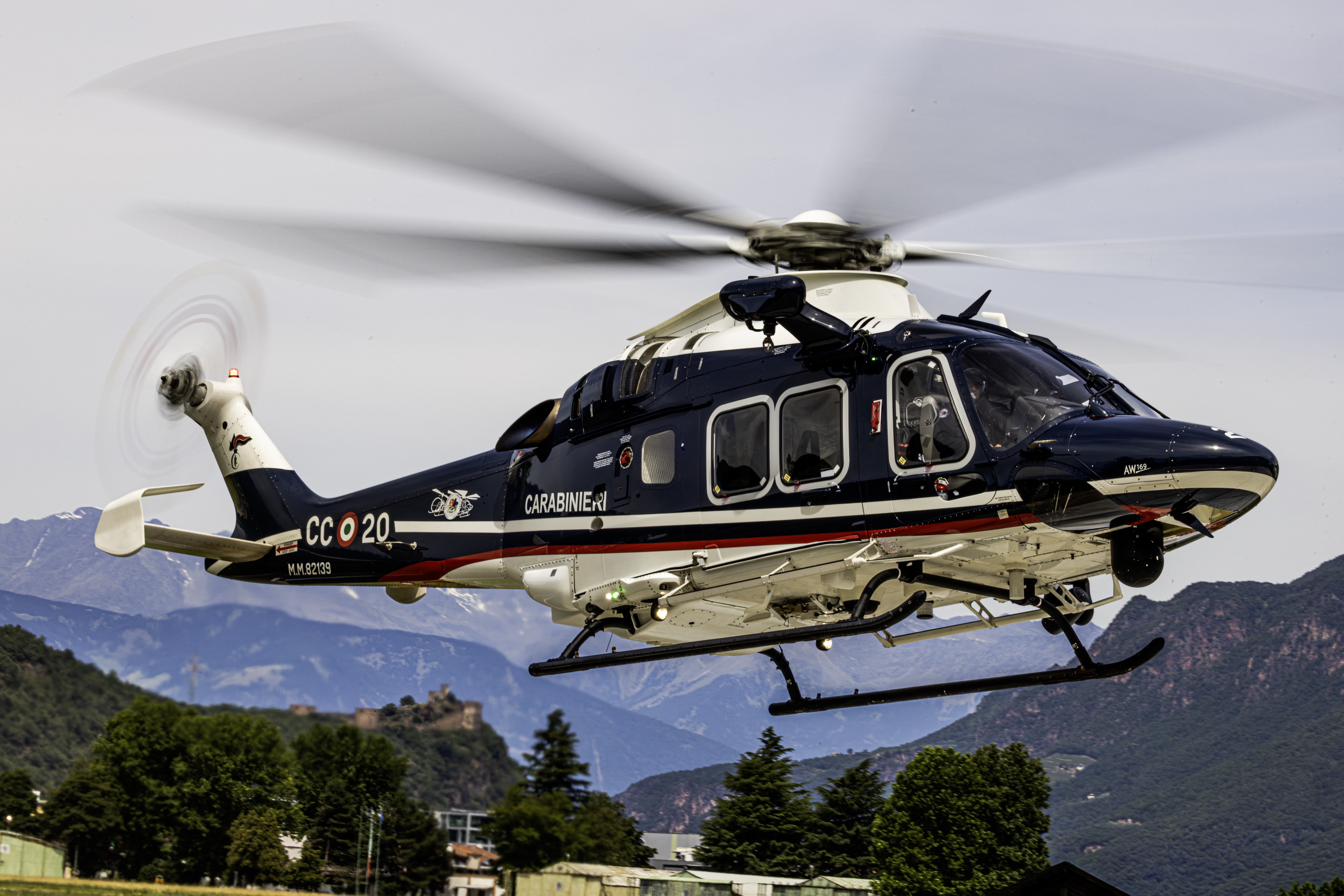 A Carabinieri UH-169C returning from a surveillance mission in the Italian Alps. This specific aircraft is the only one that still bears the unit's 60th-anniversary logo on its tail boom.