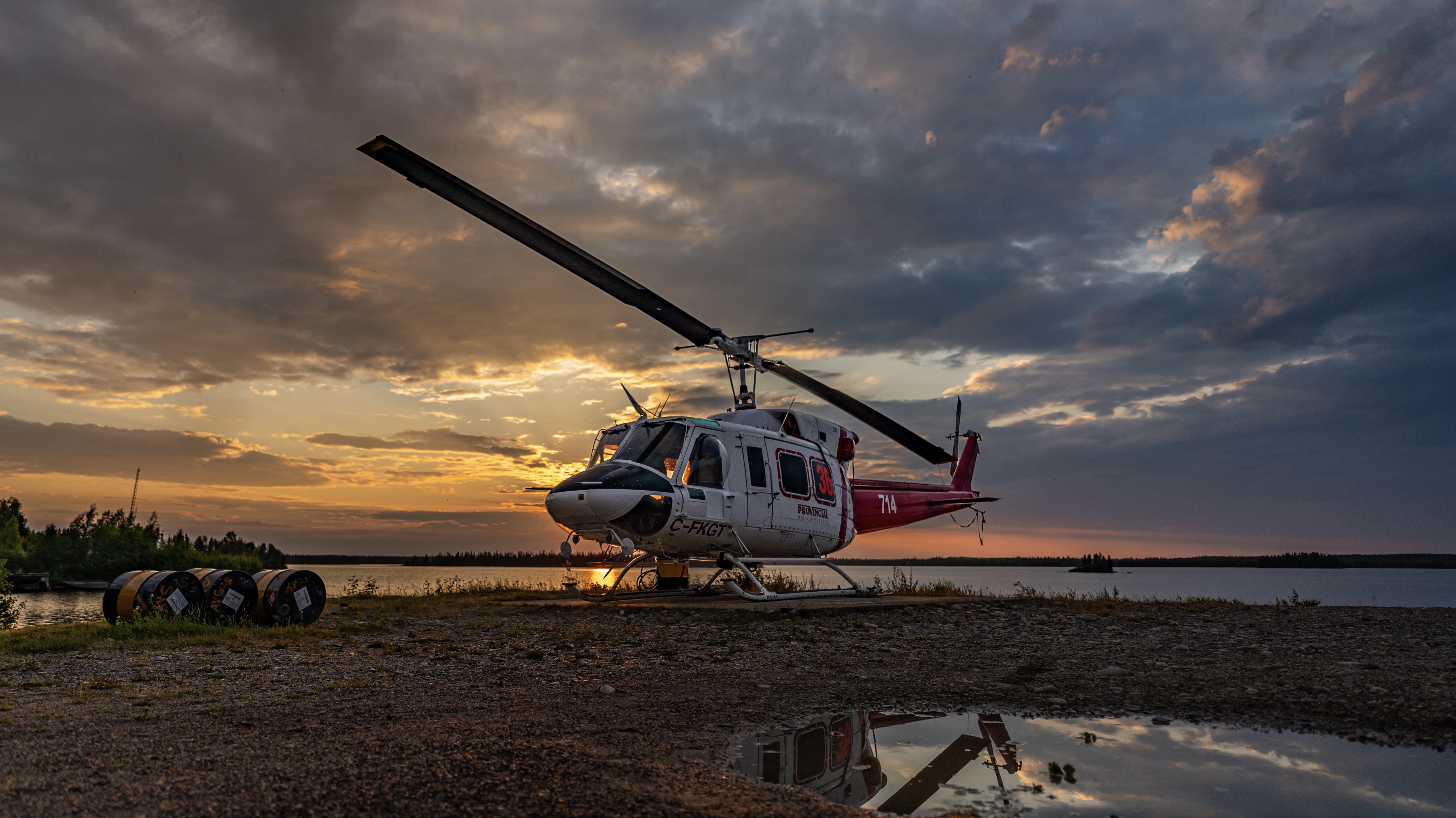 Arrived to the base early to do some pre work and watched this early morning sunrise. Bell 212 Patiently waiting for the next mission. Northern Canada.