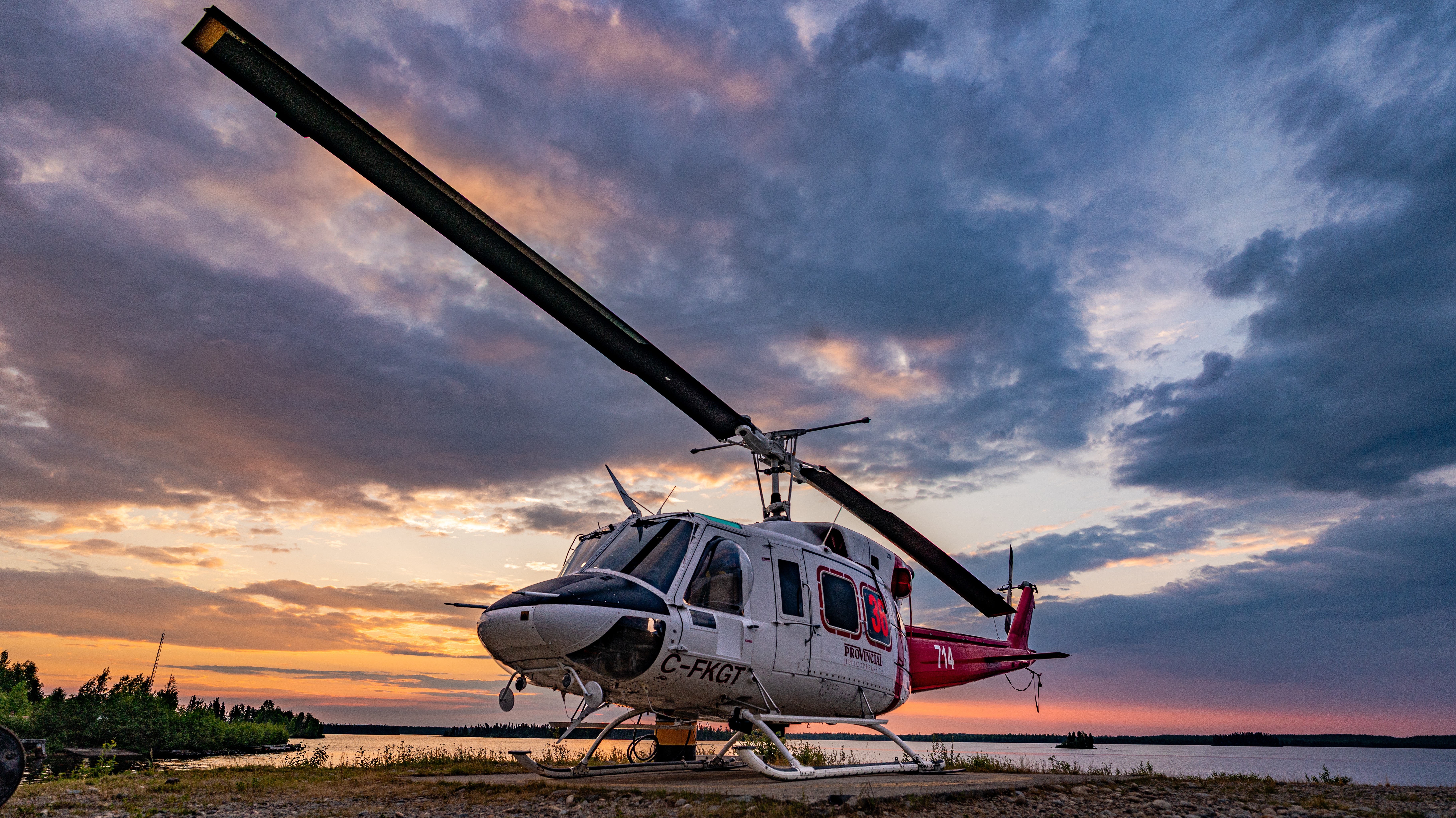 Early morning sunrise over a hardworking Bell 212. The work never stops with one of these hard to replace helicopters. Northern Canada.