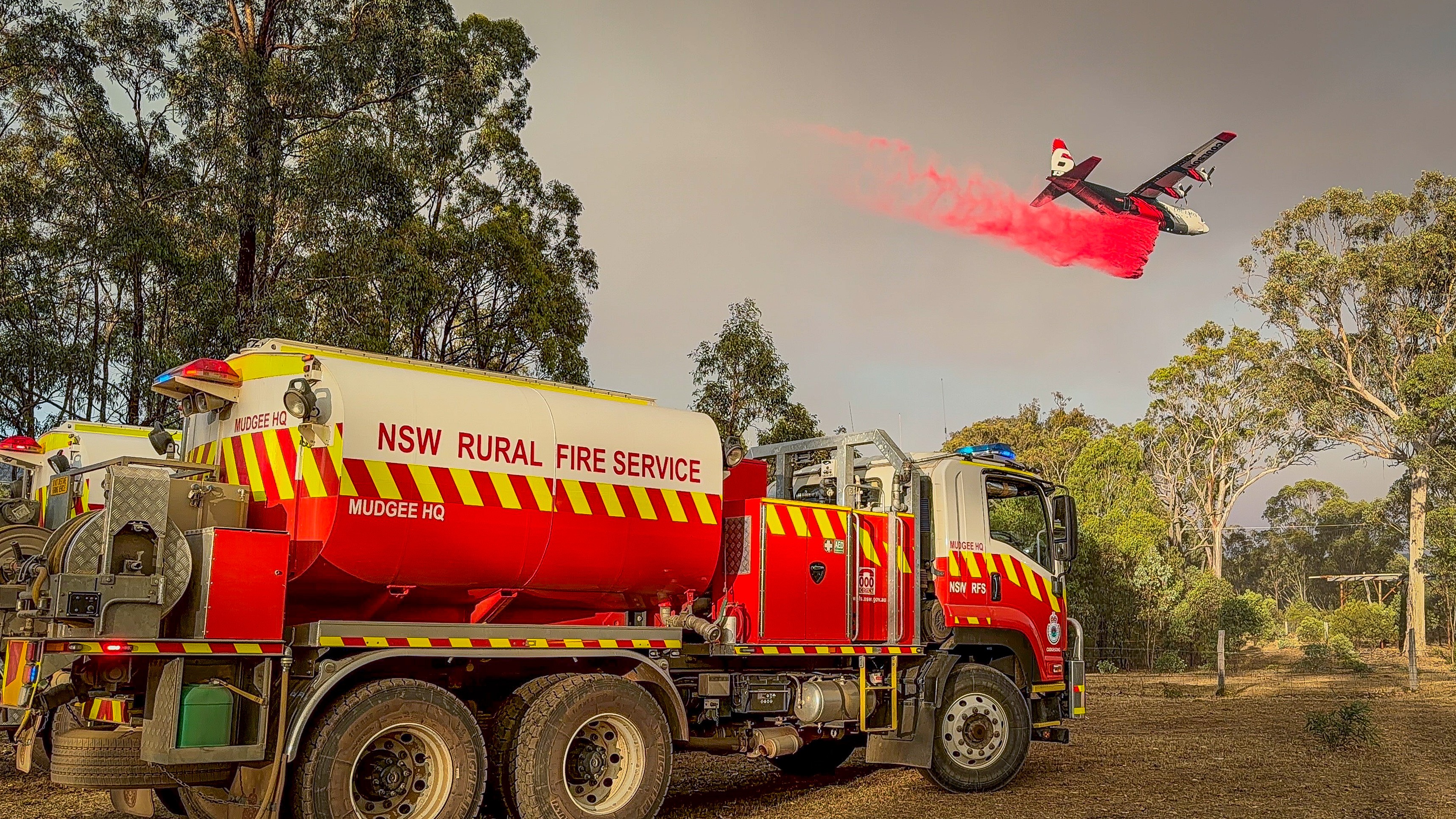 Coulson C-130 Dropping Retardent in Bogee, NSW back in January at the S44 Fire. Pictured with Mudgee HQ Cat 6. 1 of many retardant drops this C-130 had done that day.