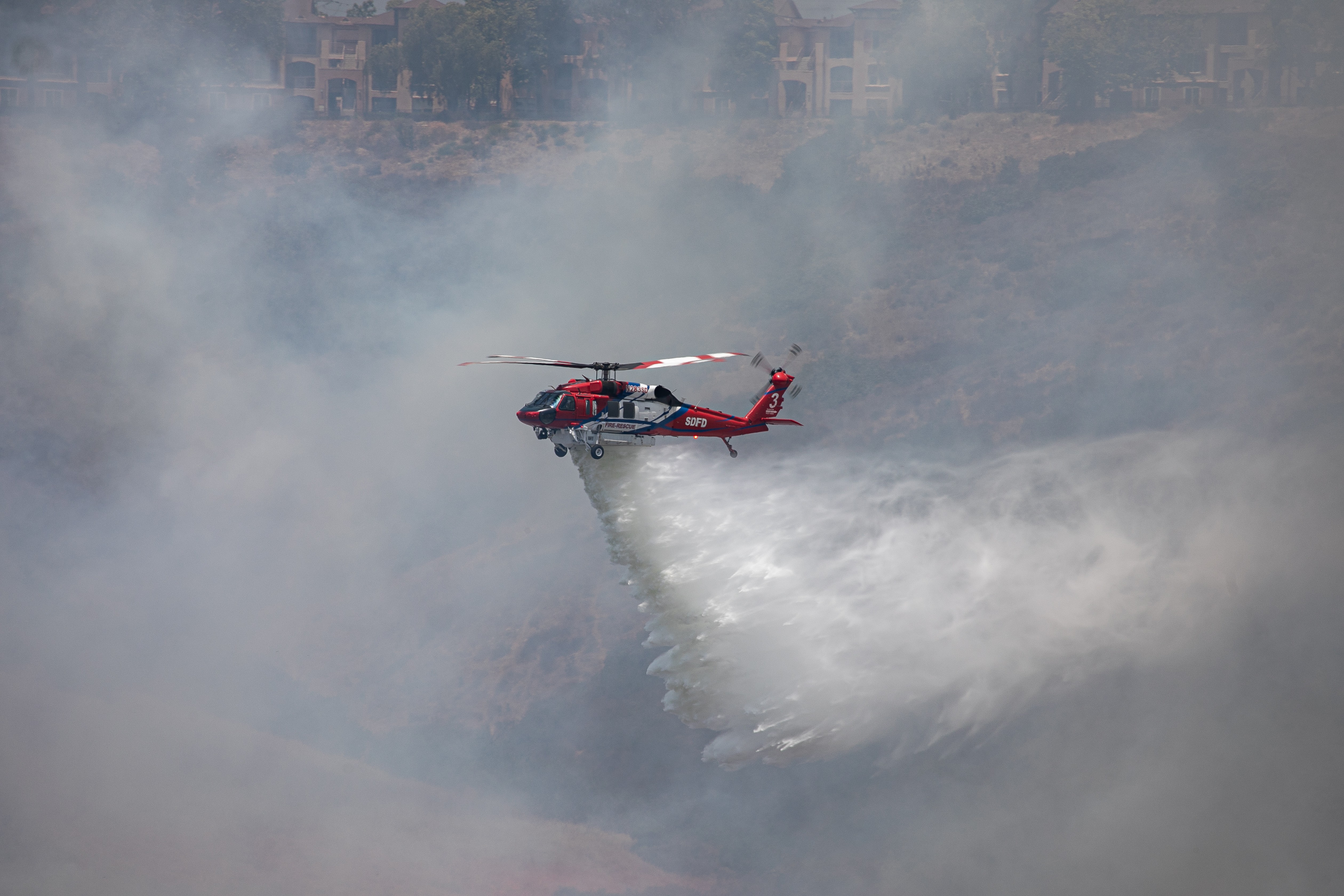 San Diego Fire-Rescue Copter 3 on a drop during the Sorrento fire on June 8th, 2026. Copter 3 made numerous drops along with 2 other copters and fixed wing aircraft.