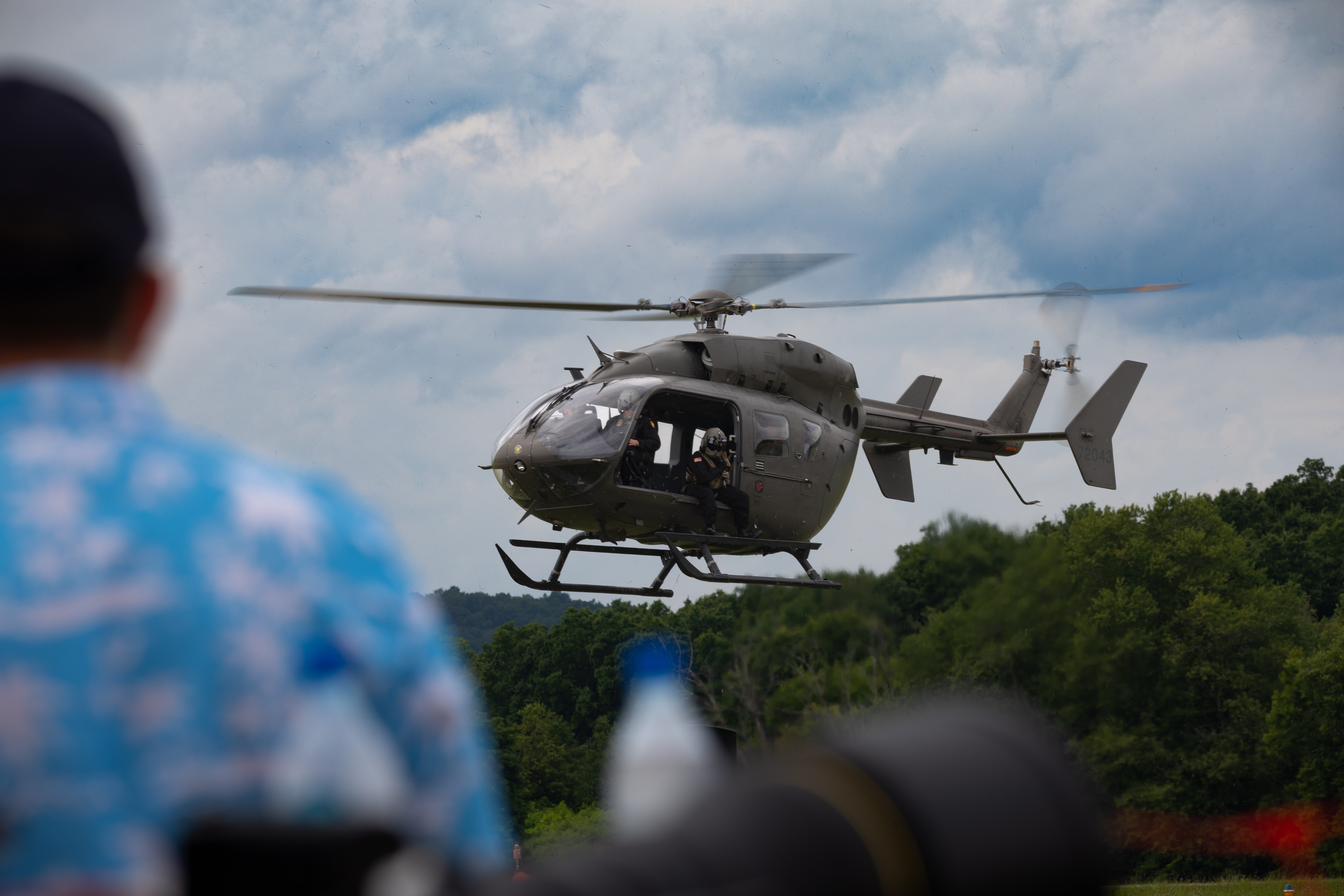 An Airbus UH-72 Lakota helicopter lands in front of the crowd at KMGJ during the 2026 New York International Air Show. The helicopter belongs to the Black Knights, the US Military Academy's parachute team.