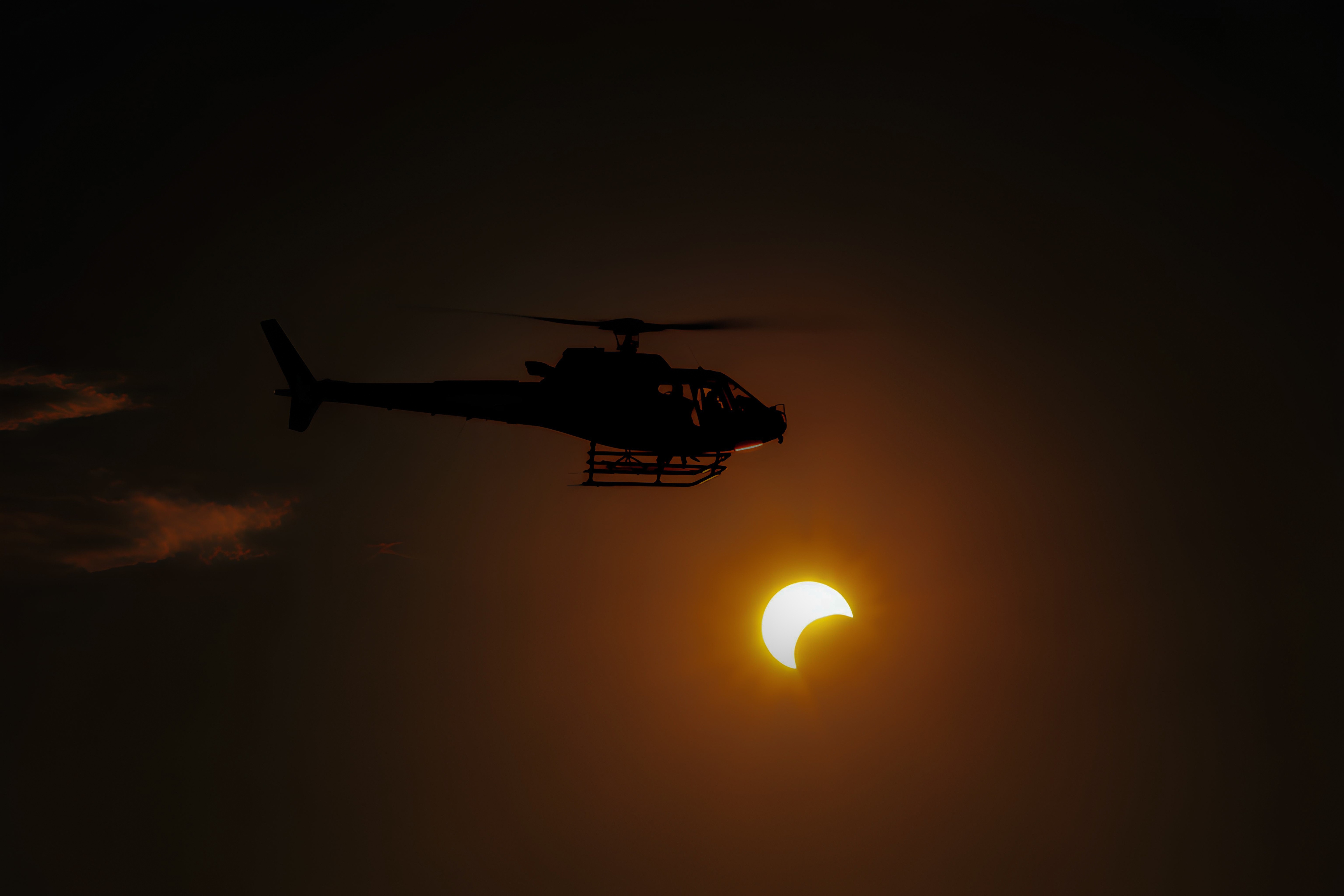 I captured this Savoie Hélicoptères H125 during the eclipse on August 12, 2026. We set out with two helicopters to drop skydivers; we were at an altitude of around 15,000 feet.