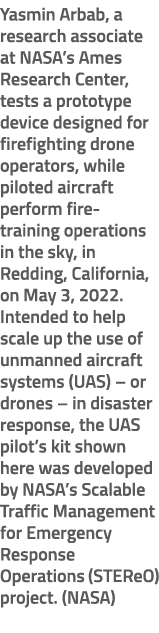 Yasmin Arbab, a research associate at NASA’s Ames Research Center, tests a prototype device designed for firefighting...