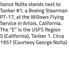 Vance Nolta stands next to Tanker #1, a Boeing Stearman PT 17, at the Willows Flying Service in Artois, California. T...