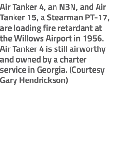 Air Tanker 4, an N3N, and Air Tanker 15, a Stearman PT 17, are loading fire retardant at the Willows Airport in 1956....