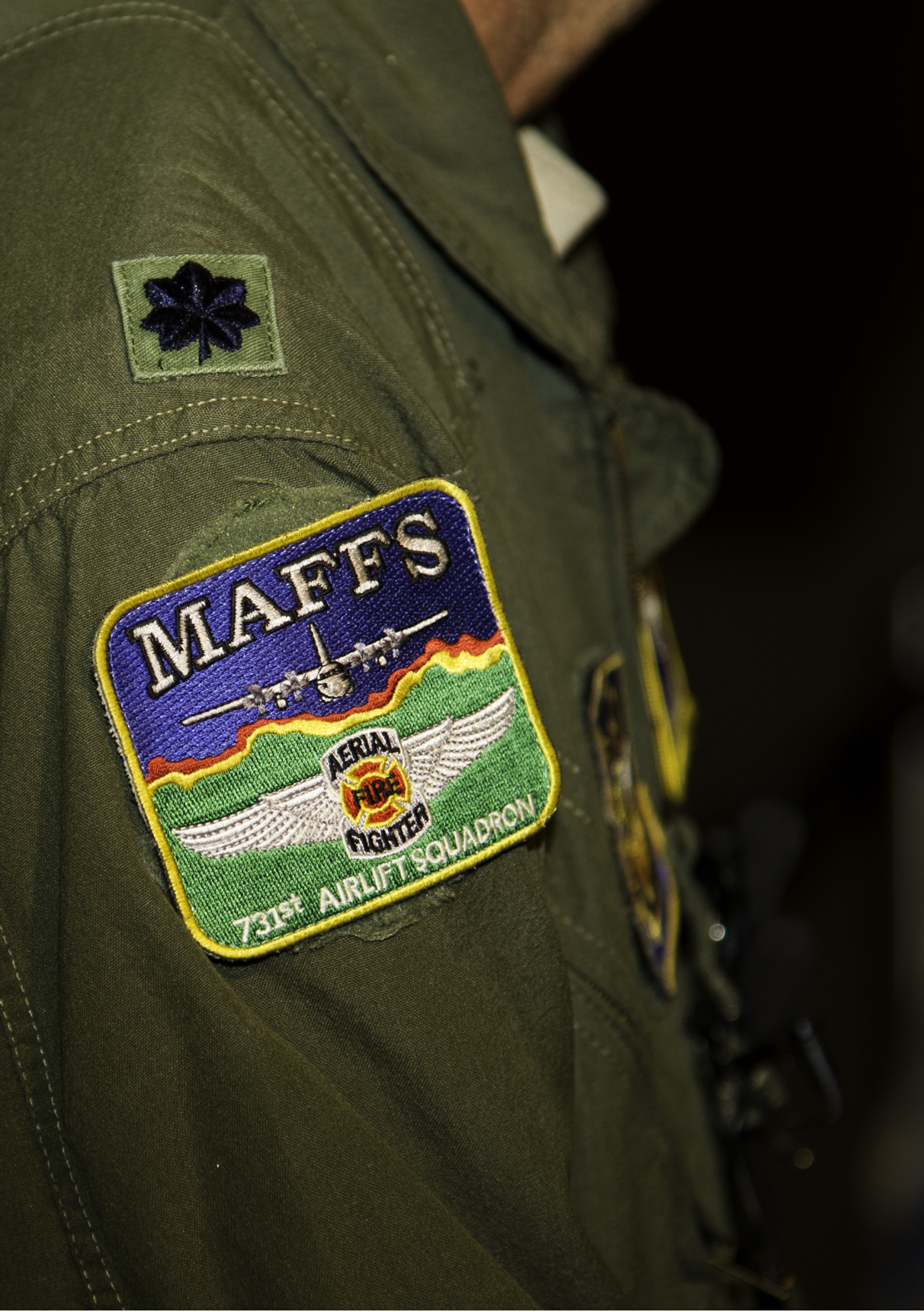 MESA, Ariz. -- The squadron patch worn by U.S. Air Force Lt. Col. Luke Thompson and fellow Modular Airborne Fire Fighting System crew members from the 302nd Airlift Wing, U.S. Air Force Reserve Command. Thompson wore the patch during a statement to reporters at Phoenix-Mesa Gateway Airport here July 3, 2013, shortly after the arrival of four military C-130 airplanes equipped with the Modular Airborne Fire Fighting System. The system’s equipment is owned by the U.S. Forest Service. It is loaded onto a C-130 and used to spray up to 3,000 gallons of fire retardant or water in order to check the advance of wildland fires. (U.S. Air Force photo by Staff Sgt. Jared Becker/Released)