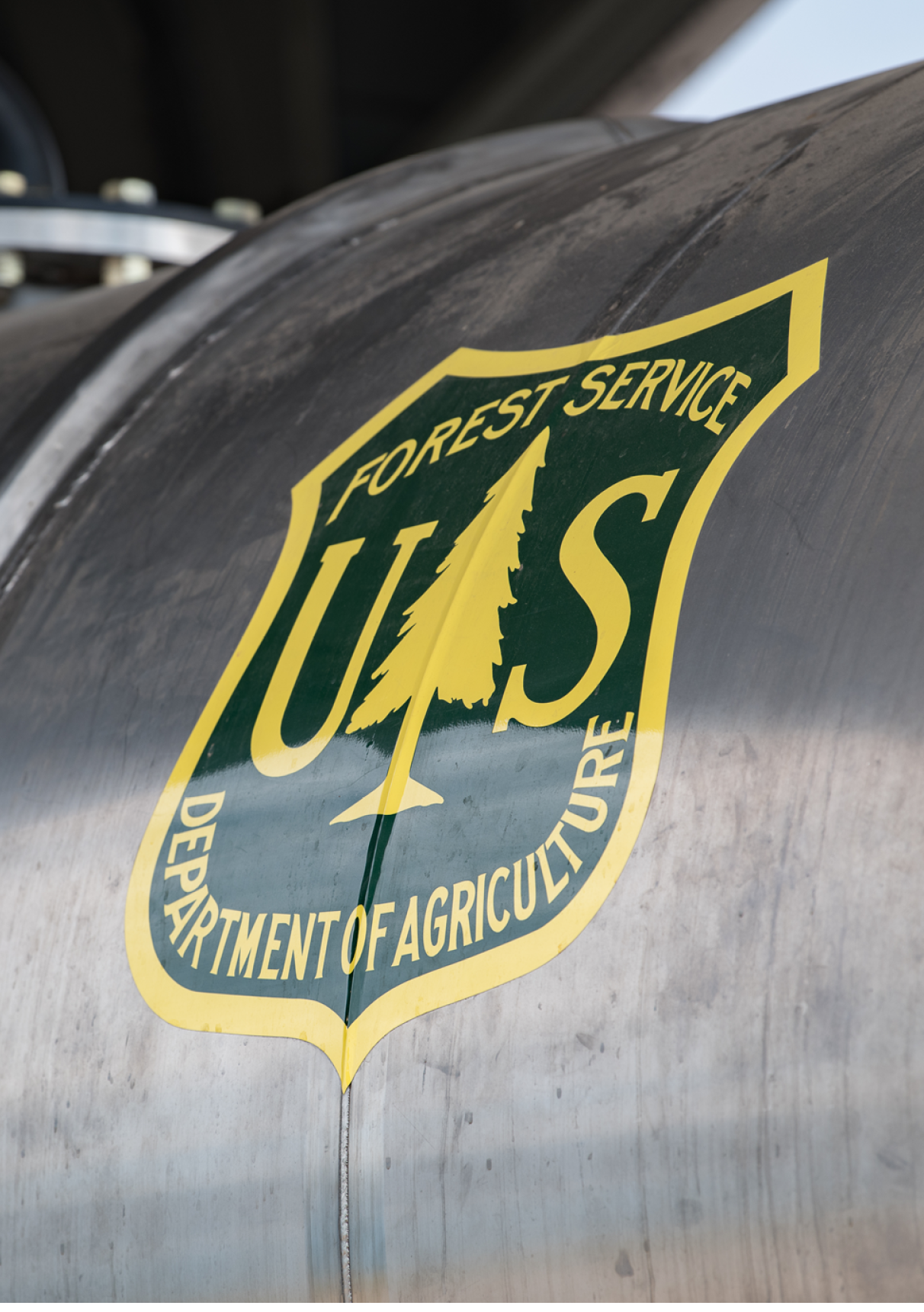 PETERSON SPACE FORCE BASE, Colo. -- A 302nd Airlift Wing team loads a U.S. Forest Service Modular Airborne Firefighting System unit into the cargo bay of a C-130H aircraft at Peterson Space Force Base, Colorado, Aug. 1, 2023. The unit enabled the crew to use the aircraft to perform the 302 AW aerial firefighting special mission. (U.S. Air Force photo by Tech. Sgt. Justin Norton)
