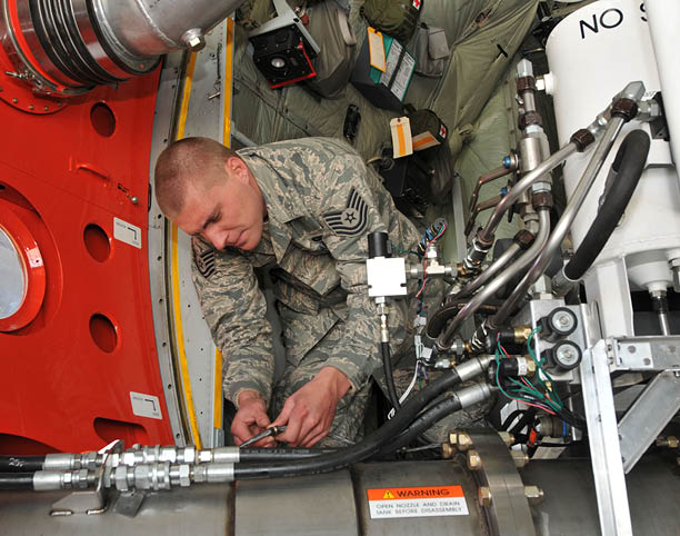 U.S. Air Force Tech. Sgt. Kristopher Leist, crew chief for the 145th Maintenance Squadron, North Carolina Air National Guard, conducts final installation checks on a Modular Airborne Fire Fighting System nozzle onboard a 145th Airlift Wing C-130 aircraft “MAFFS 9" during their annual MAFFS training for certification. This year's training is hosted by the 153rd Airlift Wing, Wyoming Air National Guard, held at the Cheyenne Regional Airport, Cheyenne, Wyo., May 6, 2013. (U.S. Air National Guard photo by Tech. Sgt. Patricia Findley/Released)