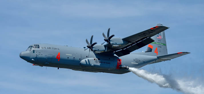 A C-130 (MAFFS 4) from California Air National Guard's 146th Airlift Wing performs a water drop April 24, 2025, during Modular Airborne Fire Fighting System (MAFFS) Spring Training 2025, held at the Channel Islands Air National Guard Base in Port Hueneme, Calif. This particular part of the training was conducted in the Angeles National Forest near Green Valley, California from April 21-27, 2025. Training included classroom sessions, flying and ground operations for Air Force aircrews, civilian lead plane pilots and support personnel from the USDA Forest Service, other federal agencies and CAL FIRE. First Air Force (Air Forces Northern), U.S. Northern Command's Air Component, is the DoD's operational lead for the aerial military wildland fire fighting response.
