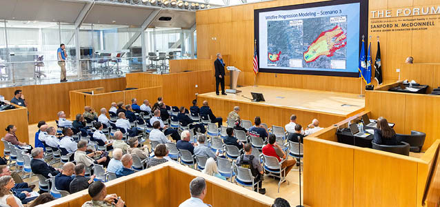 U.S. AIR FORCE ACADEMY, Colo. -- Facilitators lead in-depth discussions with Academy staff and local, state and federal partners during a wildfire-and-post-wildfire-flood tabletop exercise at the U.S. Air Force Academy, Colo., Aug. 20, 2025. The exercise was designed to strengthen joint readiness for large-scale emergencies by testing decision-making, communication and cross-jurisdictional response under stress. (U.S. Air Force photo by Trevor Cokley)