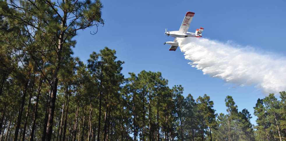 A small airplane is flying through the sky, leaving a trail of smoke behind it. AI generated content