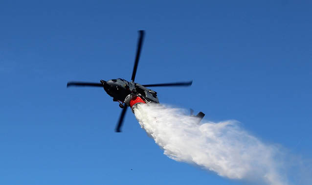 A helicopter is flying through the sky, leaving a trail of smoke behind it. AI generated content