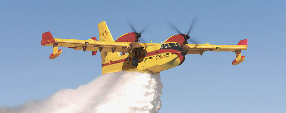 A yellow and red airplane is flying through the sky, leaving a trail of smoke behind it. AI generated content