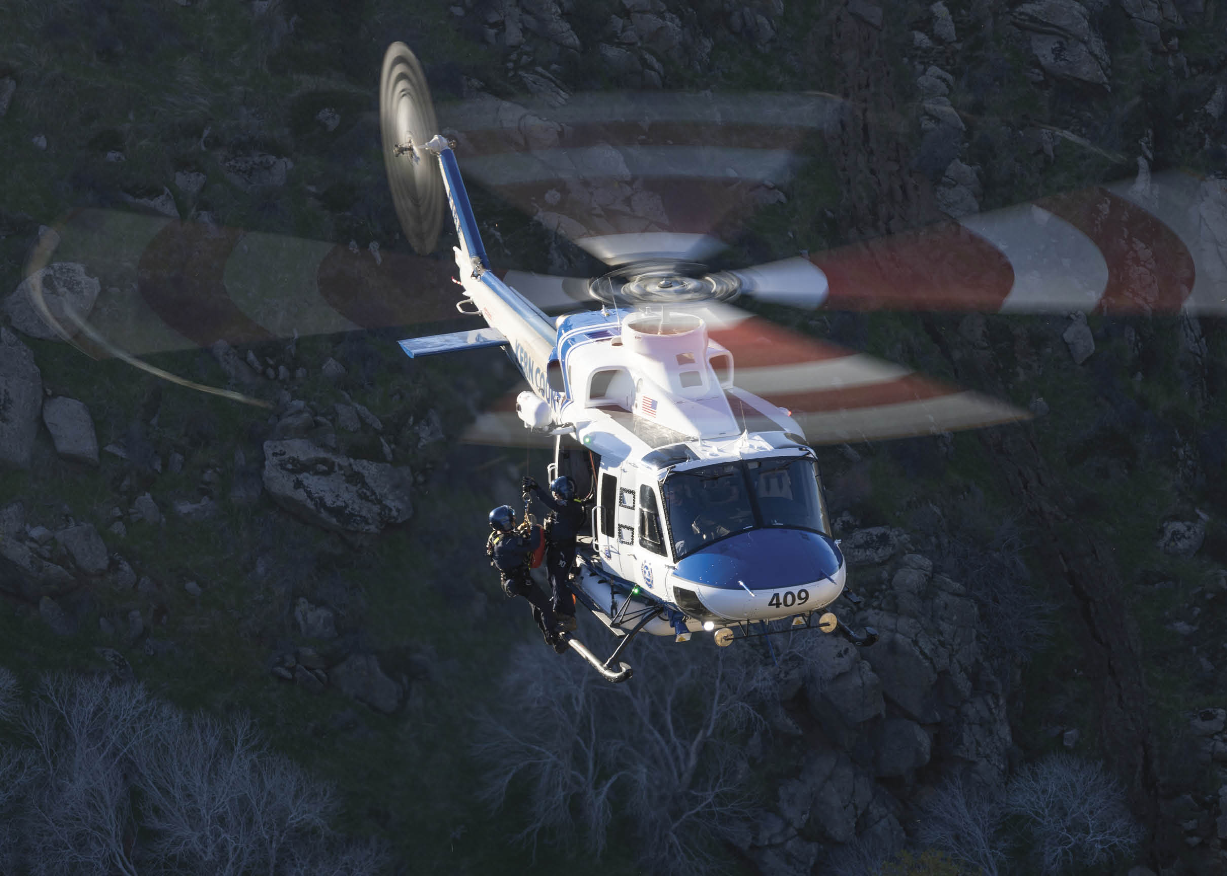 A helicopter is flying in the air with a person hanging from it. AI generated content