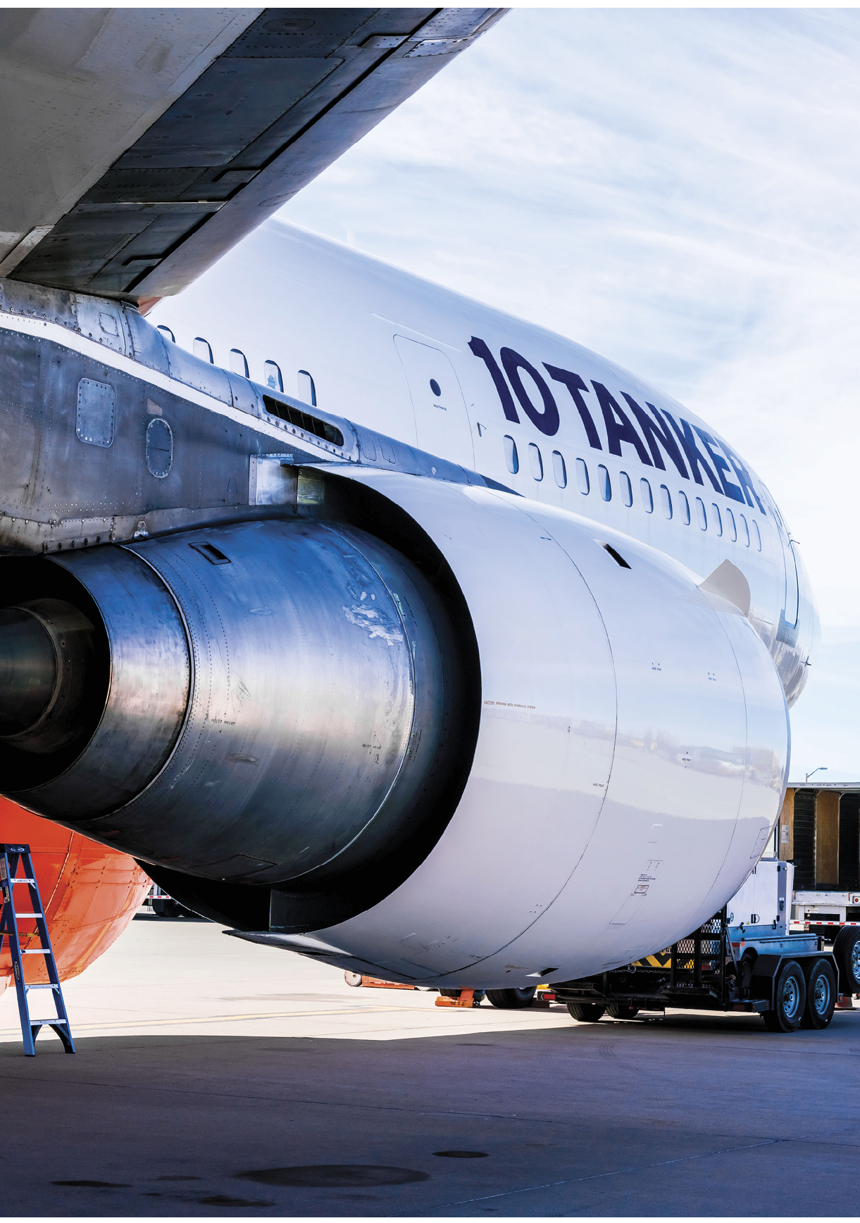 A large airplane with the number 10 on the tail is parked on the tarmac. AI generated content