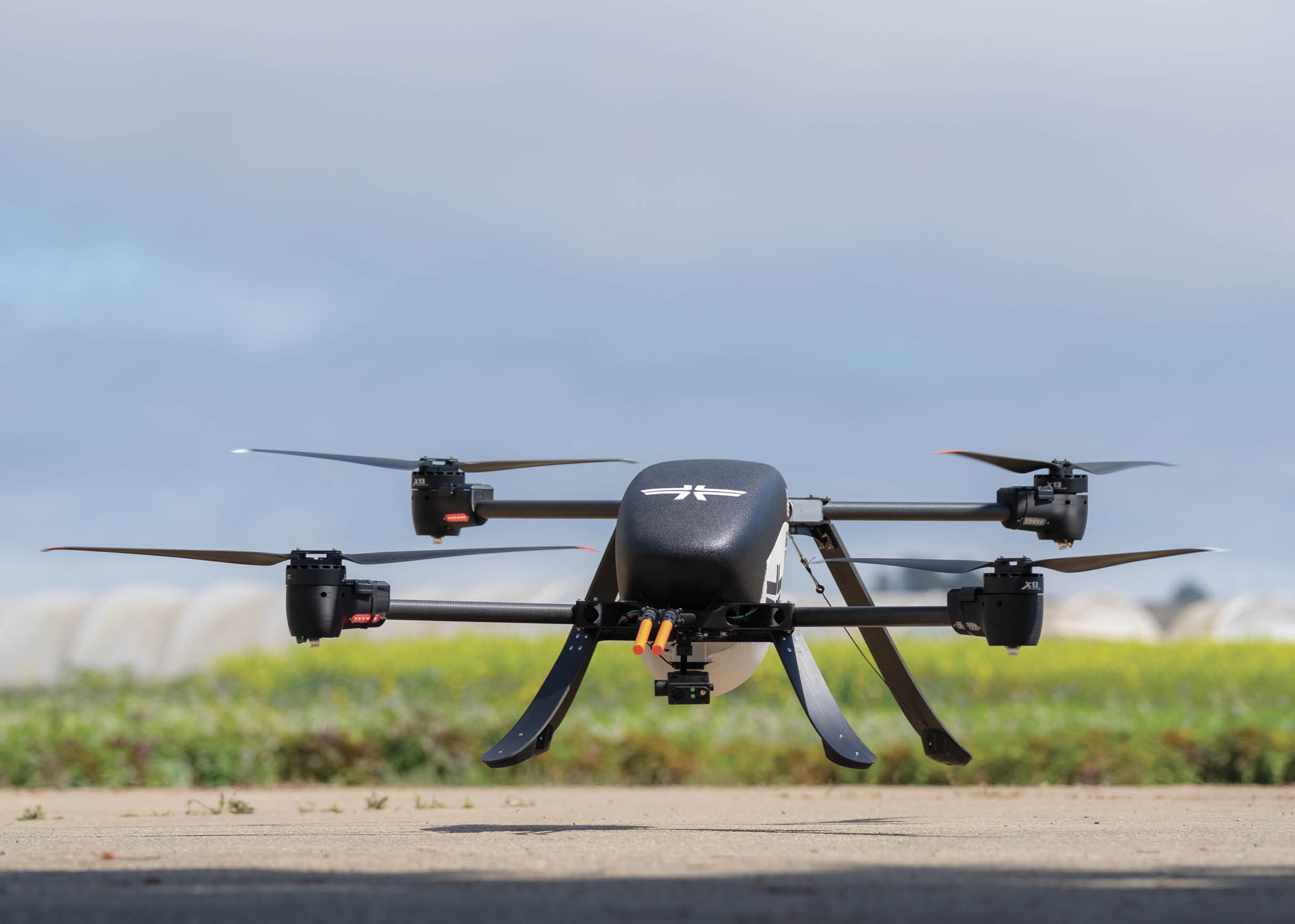 A drone is flying in the air with its landing gear down. AI generated content