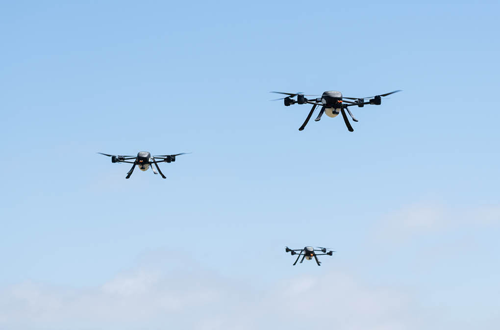 Four drones flying in the sky. AI generated content