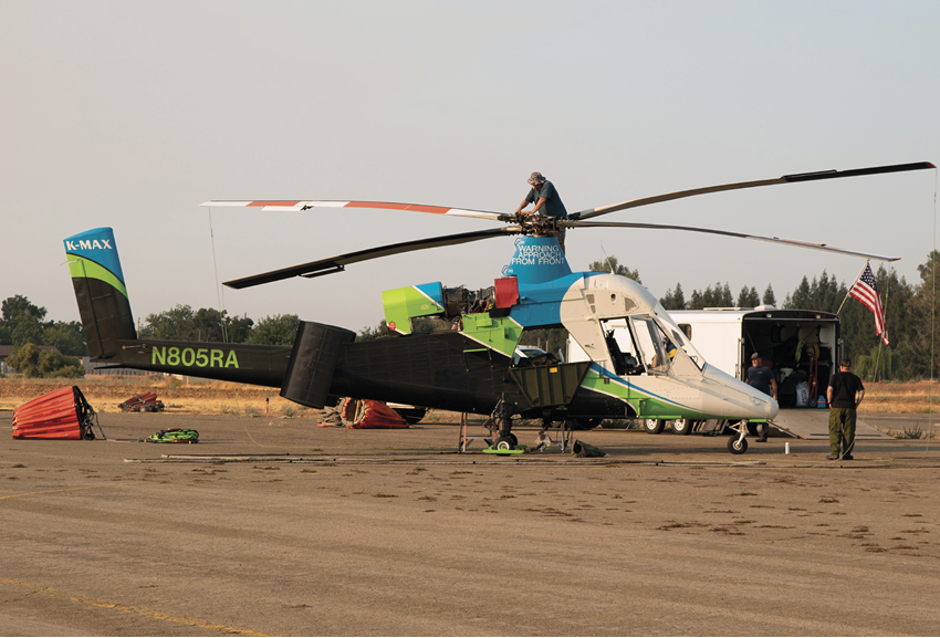A man is working on a helicopter with a large propeller. AI generated content