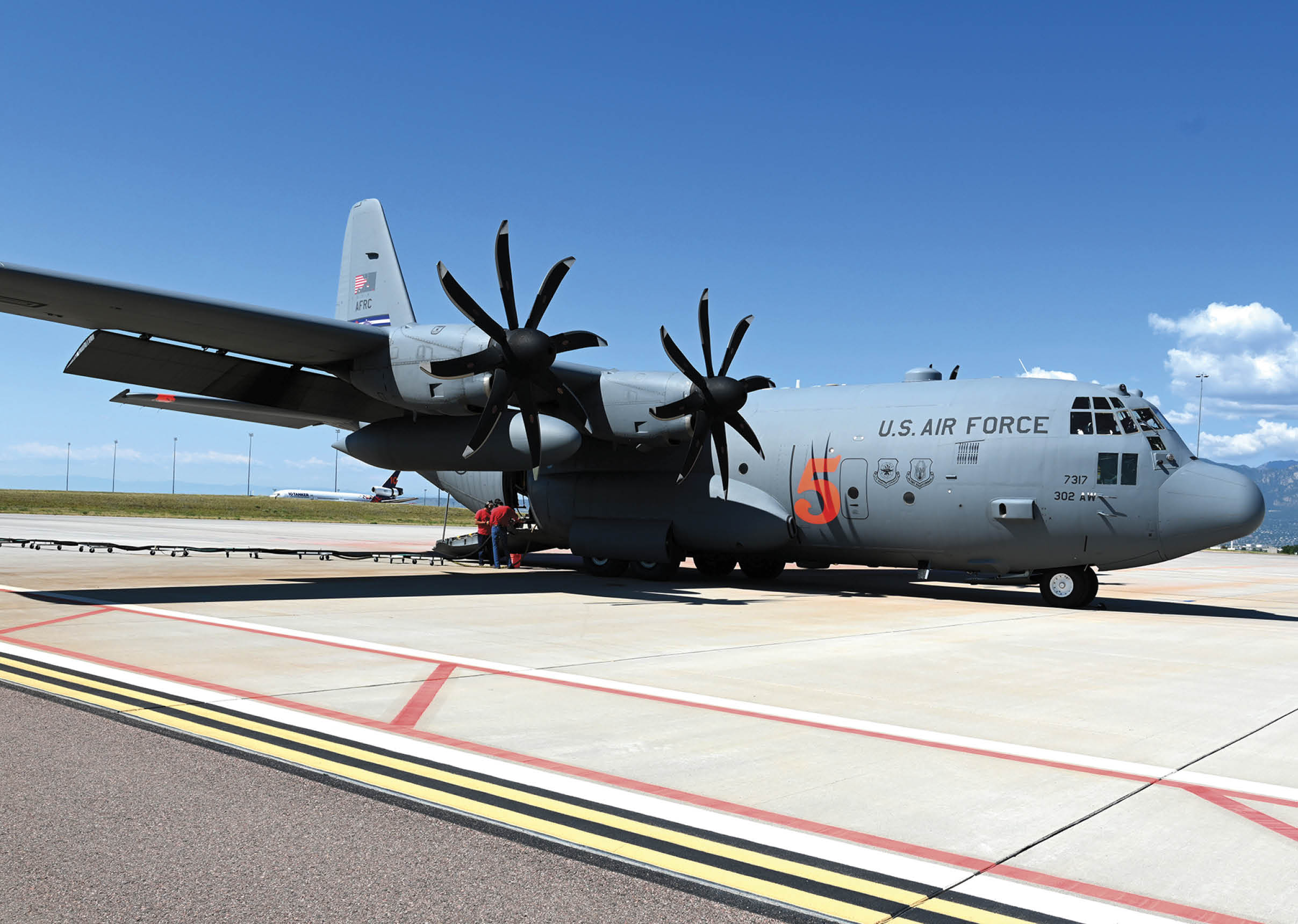 A large US Air Force plane is parked on the tarmac. AI generated content