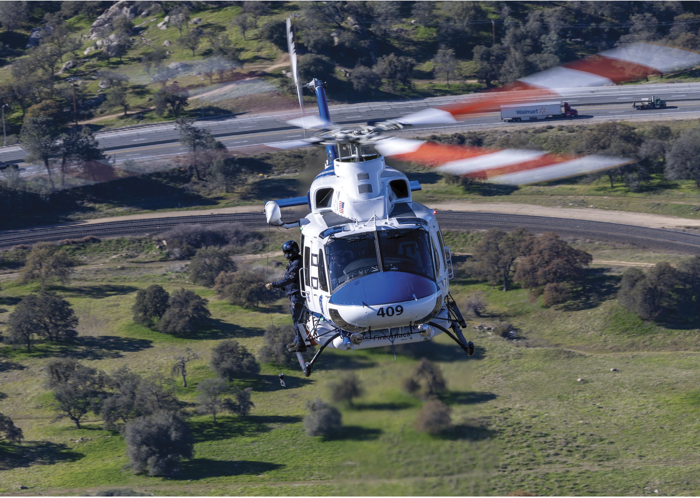 A helicopter is flying over a grassy field with a red and white striped flag. AI generated content