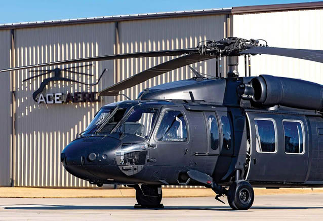 A large black helicopter is parked on the tarmac in front of a building. AI generated content