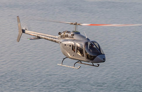 A helicopter is flying over a body of water. AI generated content
