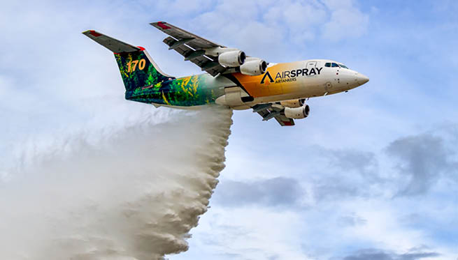 A large airplane is flying through the sky, spraying water from its back. AI generated content