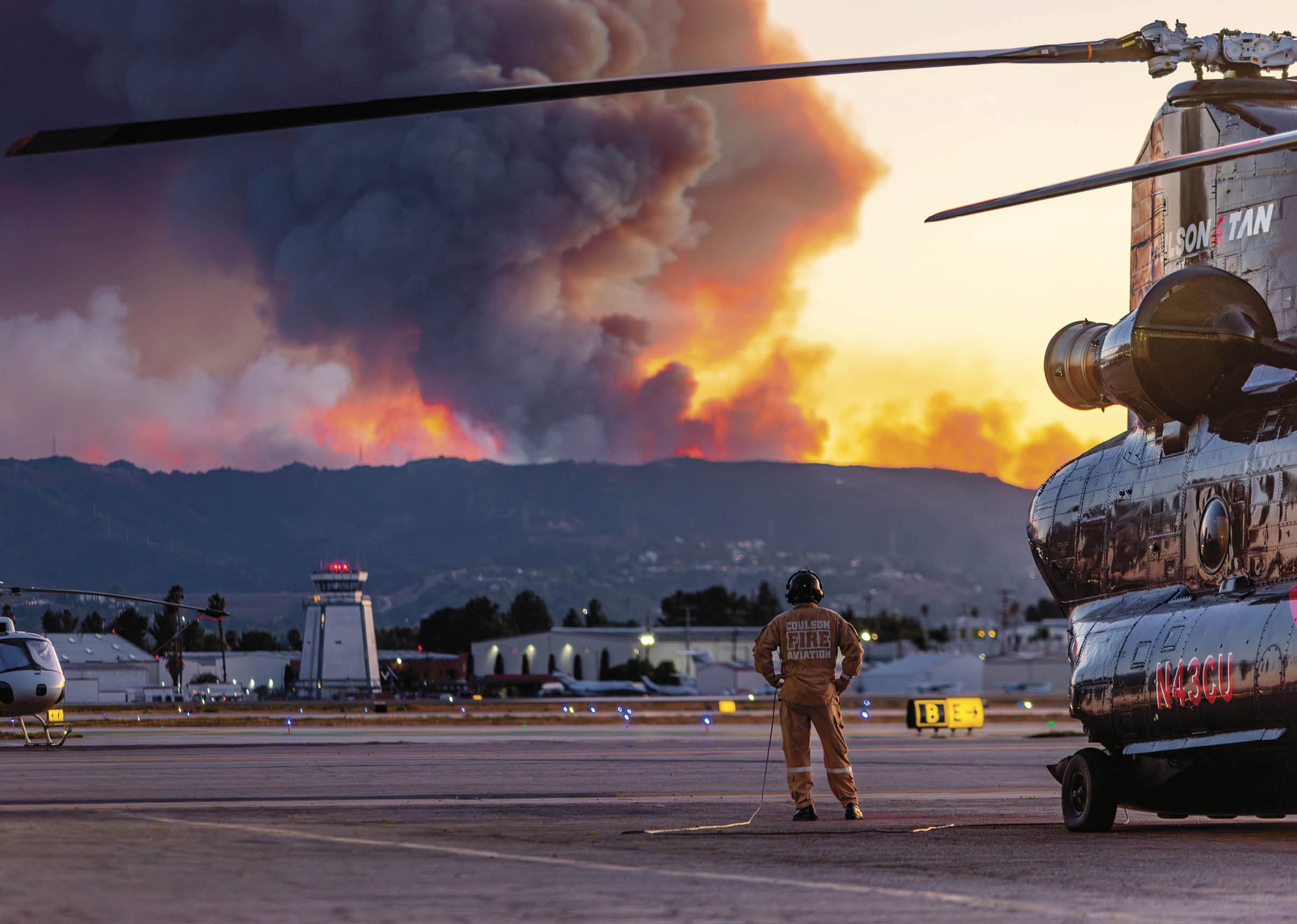A man is standing next to a helicopter on the tarmac. AI generated content