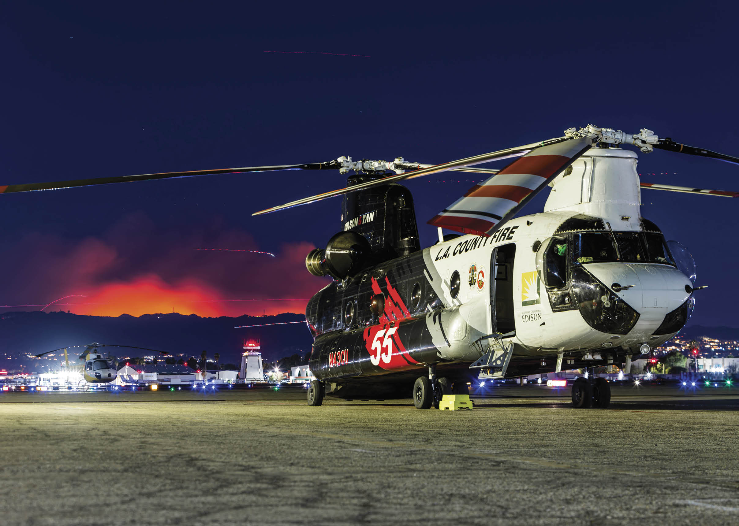 A large white helicopter with red and blue markings is parked on a runway. AI generated content