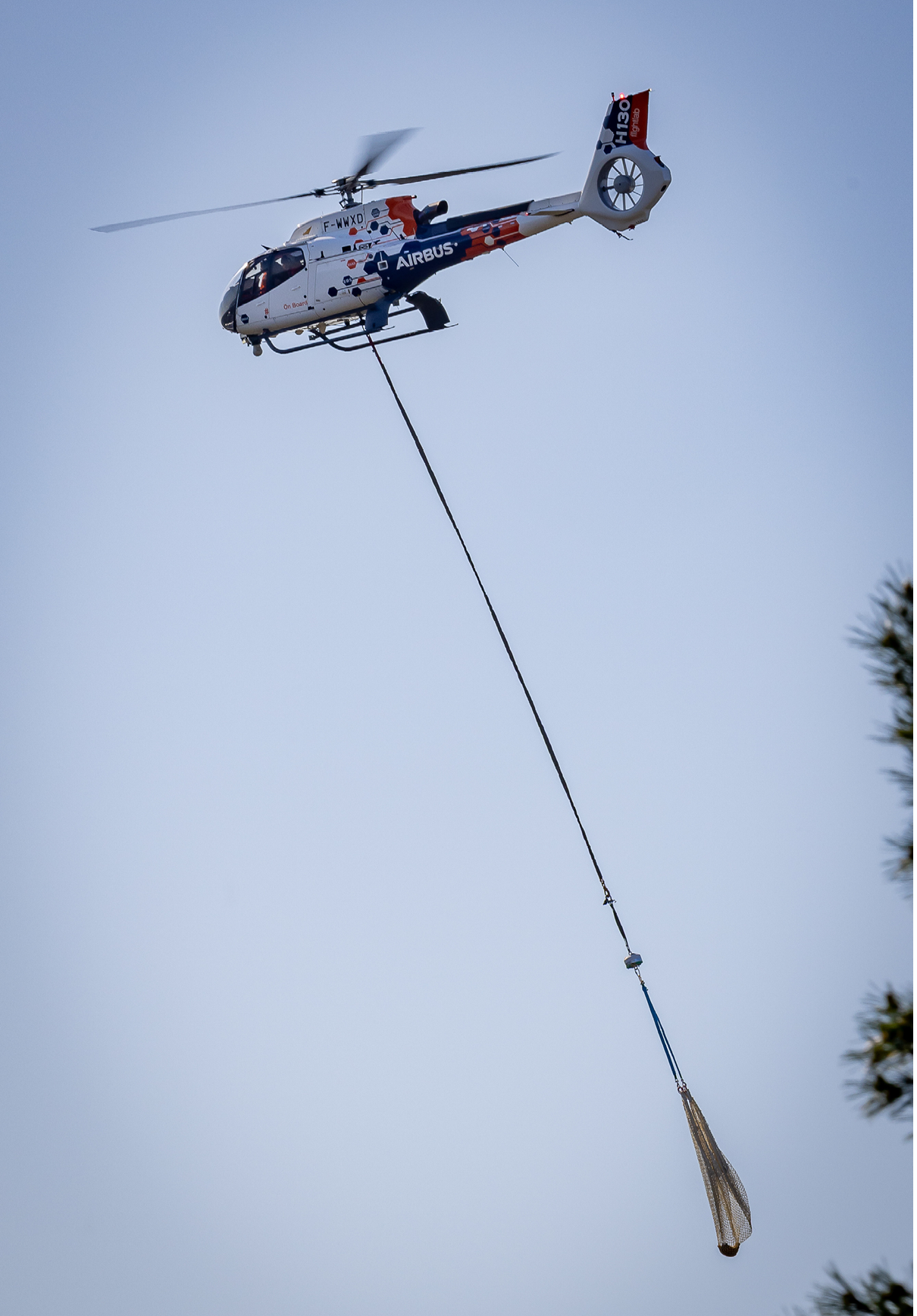A helicopter is flying with a rope attached to it, which is connected to a person. AI generated content