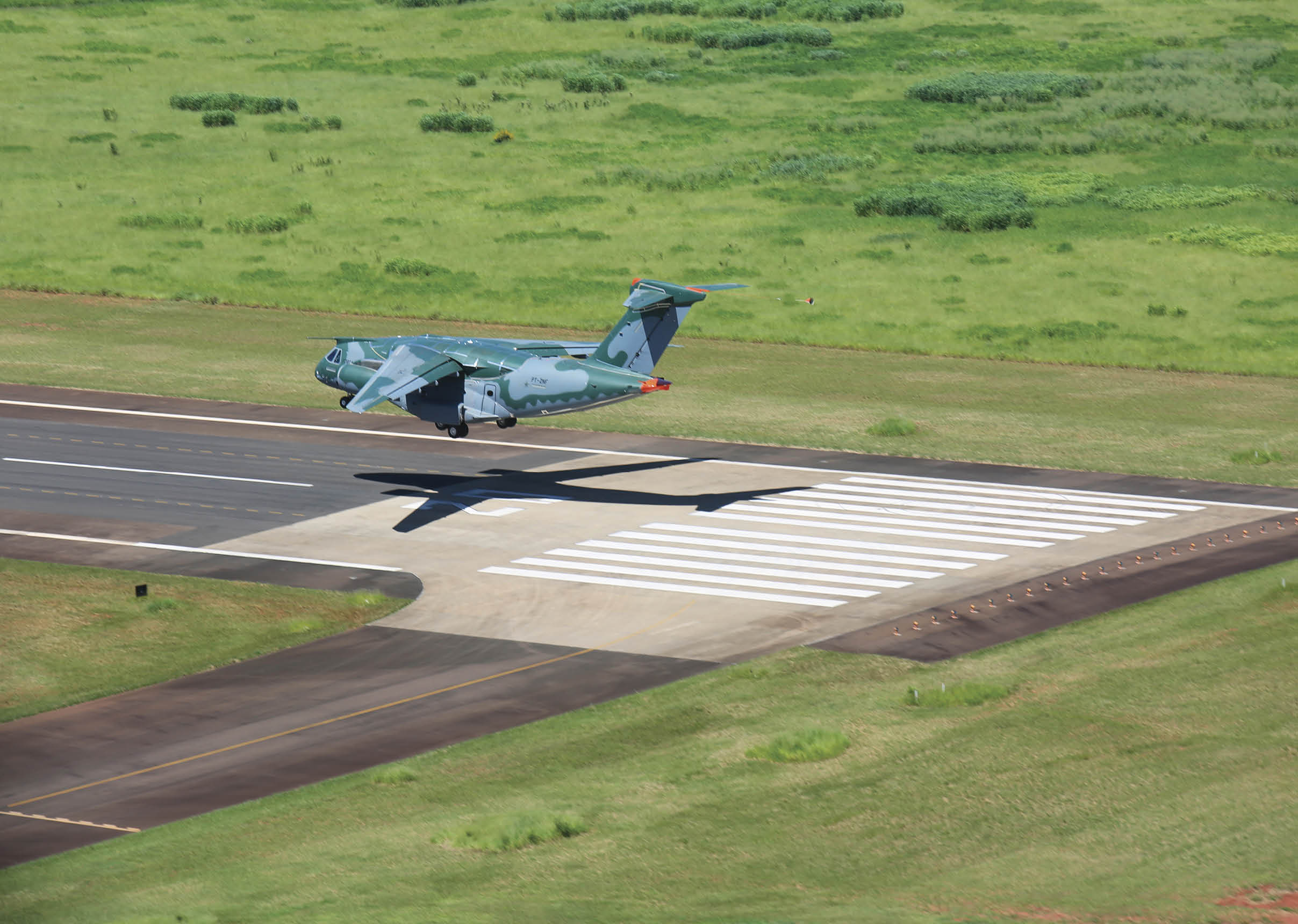 A man is standing next to a helicopter on the tarmac. AI generated content