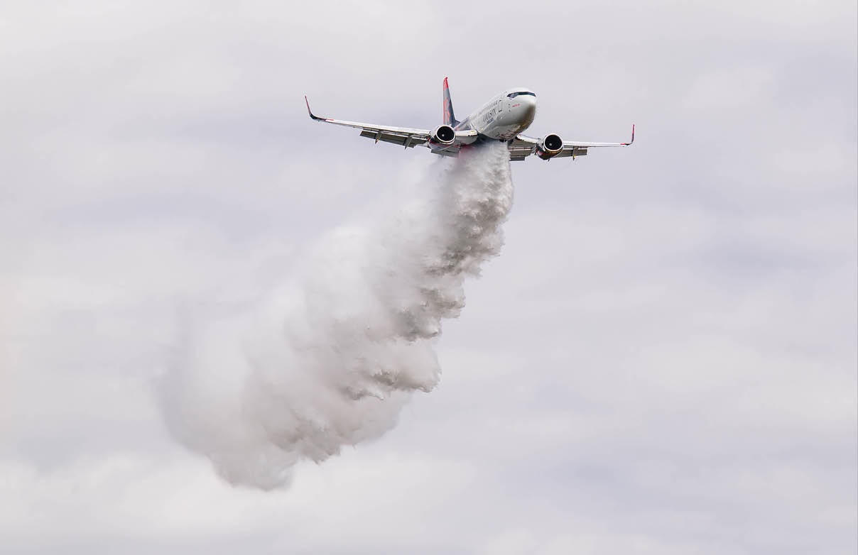 Two airplanes flying in the sky, one above the other. AI generated content