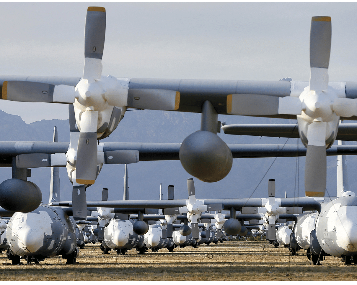C-130 Hercules cargo planes are lined up in a field at the 309th Aerospace Maintenance and Regeneration Group boneyard at Davis-Monthan Air Force Base in Tucson, Ariz. on Thursday, May 14, 2015. Over 2,300 variants of the C-130 have been produced since 1954. (AP Photo/Matt York)