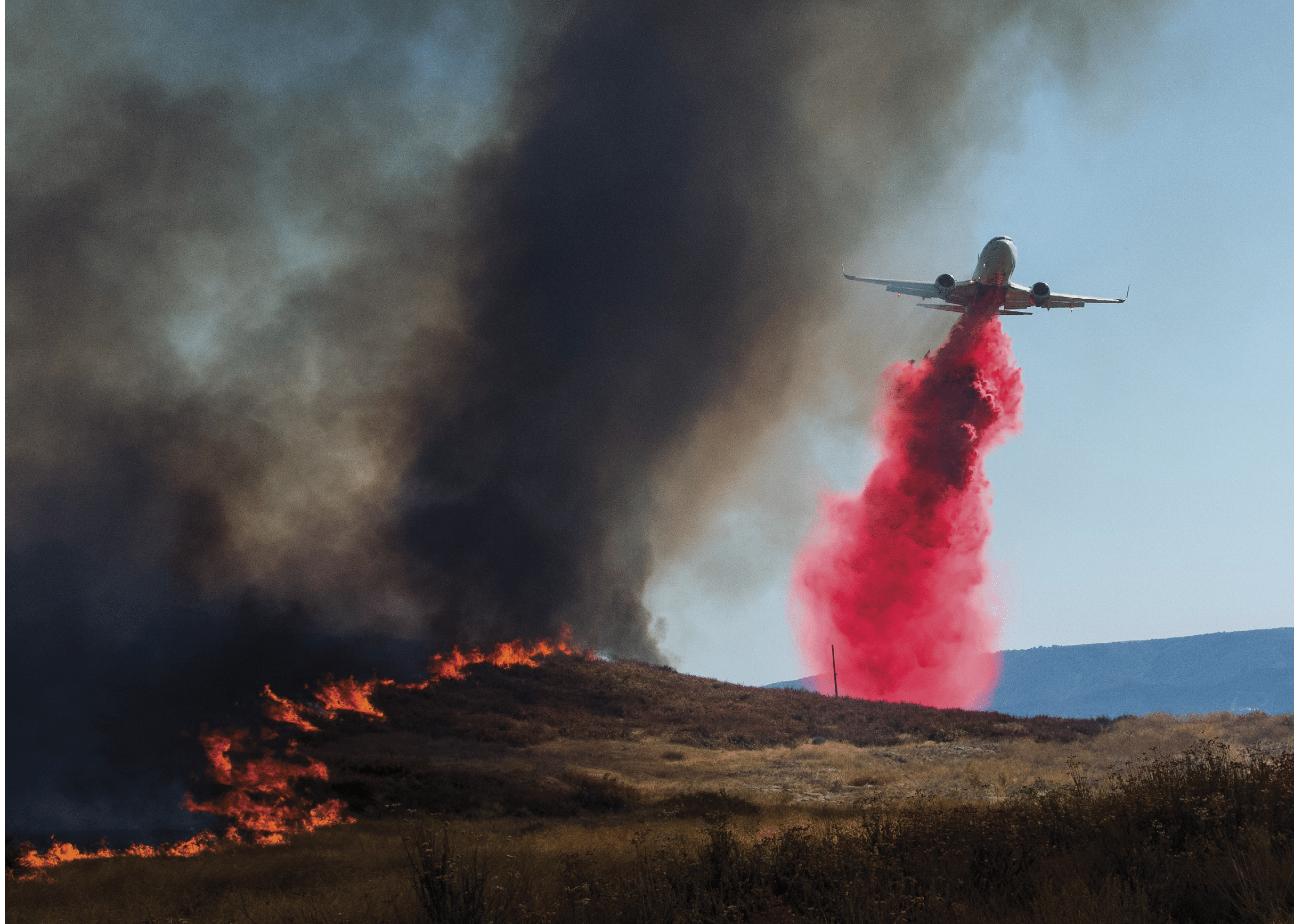 A helicopter with a red and blue tail is flying in the sky. AI generated content