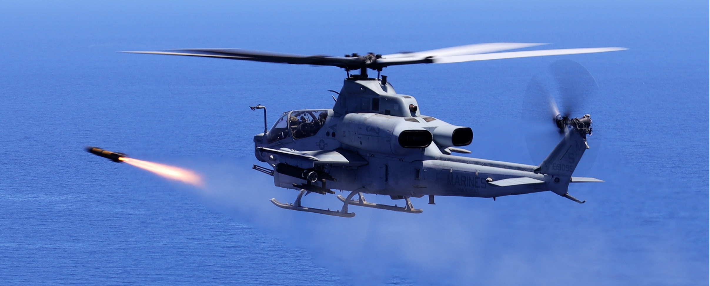 U.S. Marine Corps AH-1Z attack helicopter pilots with Marine Medium Tiltrotor Squadron 262 (Rein.), 31st Marine Expeditionary Unit, fire an AGM-179 joint air-to-ground munition (JAGM) during an expeditionary (EXPO) strike, off the coast of Okinawa, Japan, June 26, 2024. This EXPO strike launched the first JAGM off an AH-1Z in the Indo-Pacific region. The JAGM provides a true “fire and forget” capability to guide the missile to endgame, able to destroy fast-moving maritime targets like fast attack craft (FAC) in rough sea states. The 31st MEU, the Marine Corps’ only continuously forward-deployed MEU, provides a flexible and lethal force, ready to perform a wide range of military operations as the premiere crisis response force in the Indo-Pacific region. (U.S. Marine Corps photo by Cpl. Christopher Lape)