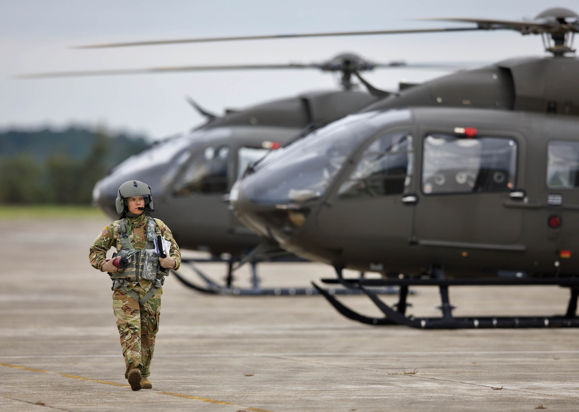 U.S. Army Warrant Officer 1 Amy Berner, assigned to Bravo Company, 1st Battalion, 145th Aviation Regiment, walks off of the flight line after flying a UH-72 Lakota Helicopter on Toth Stagefield Army Heliport, Fort Rucker, AL,. November 8, 2019. These Army Aviation students are completing their first phase of flight training to become U.S. Army helicopter pilots. (U.S. Army Reserve Photo by Staff Sgt. Austin Berner)