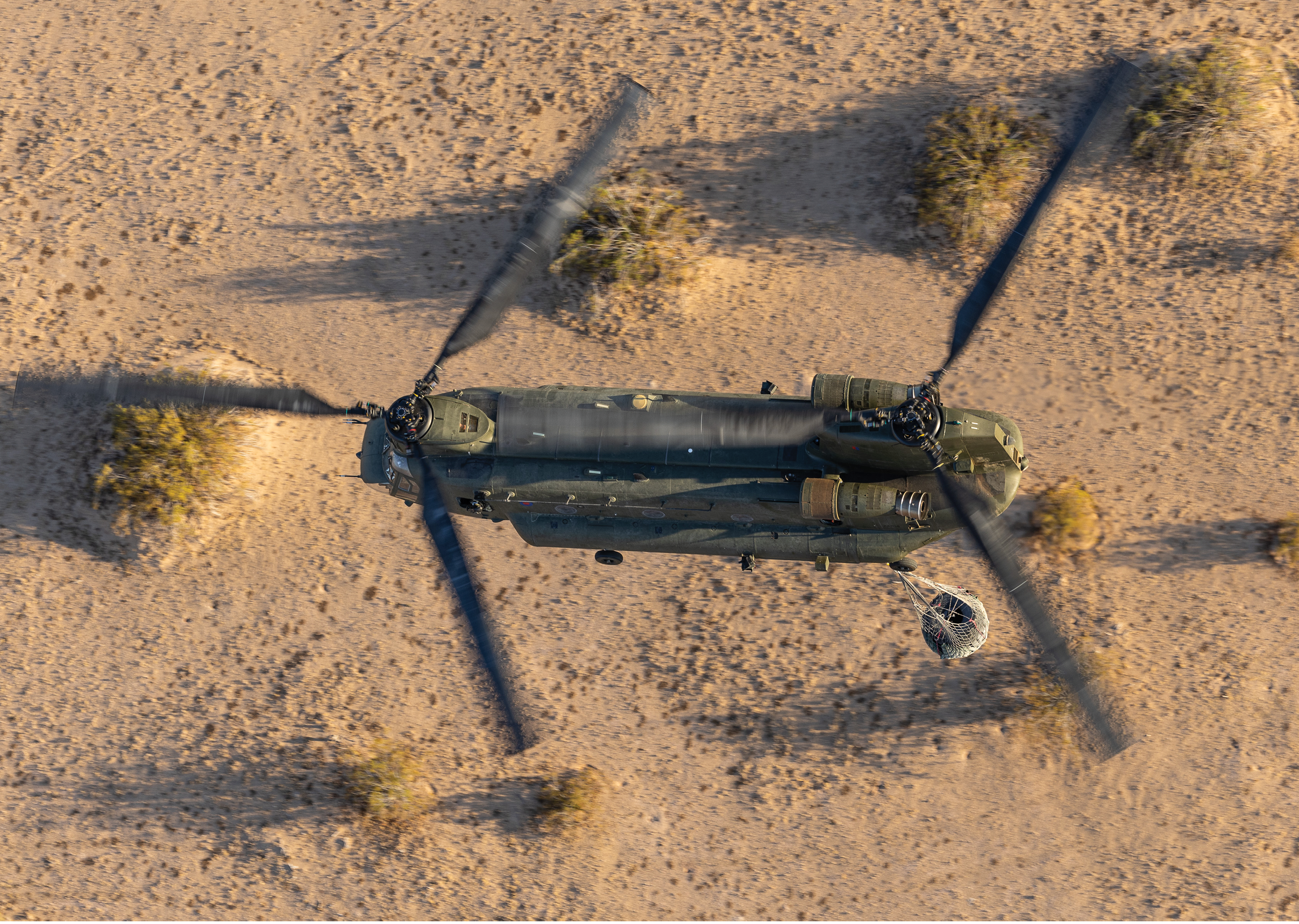 Pictured: An RAF Chinook carrying an underslung load makes an approach towards a landing site in the desert, near El Centro USA. Chinooks from 18 Sqn RAF Odiham have deployed to Naval Air Facility El Centro USA on Exercise Vortex Warrior.   Exercise Vortex Warrior will allow the Chinook Force to practise their high-merit flying skills in desert and mountainous environments.
