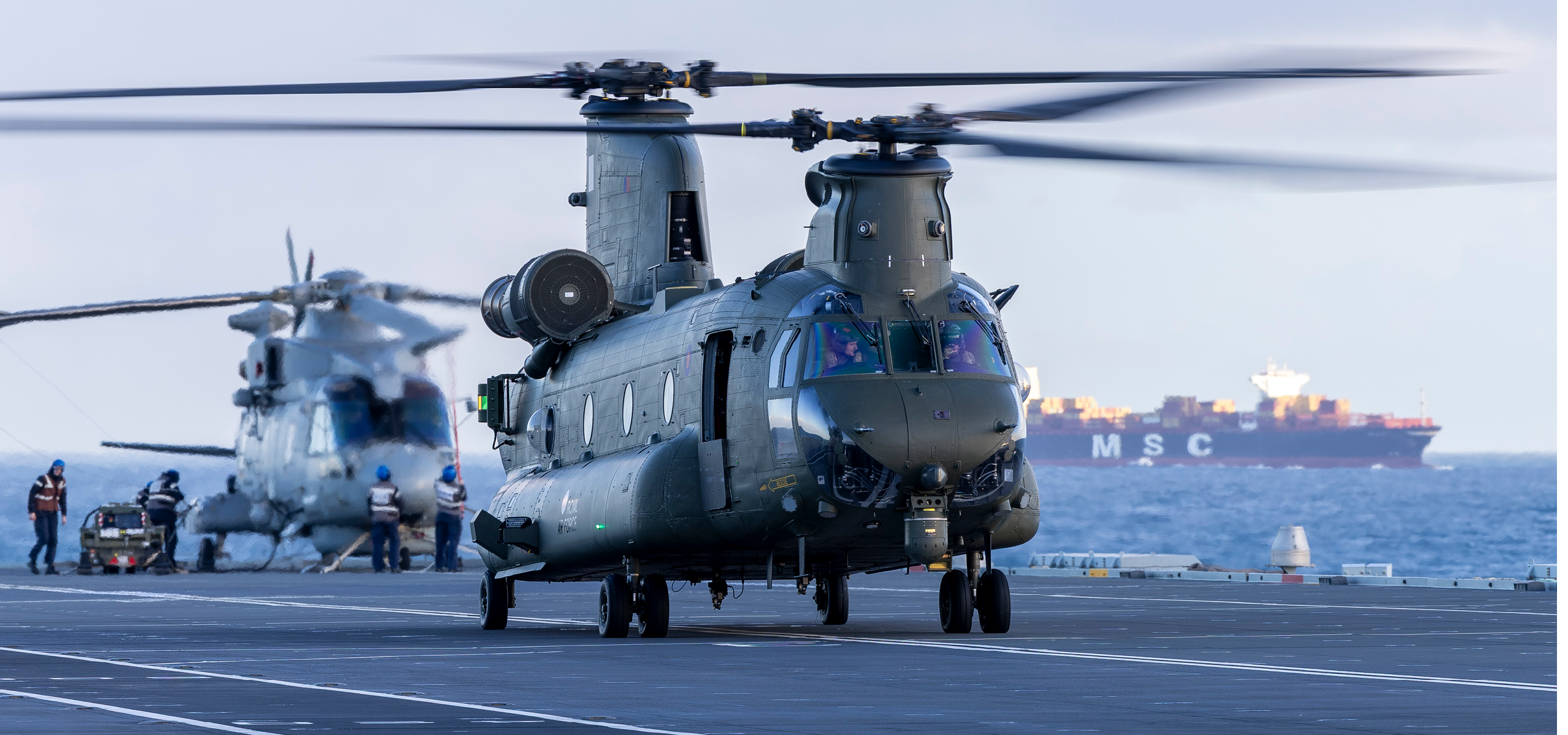 Pictured: Chinooks of 27 Squadron, RAF Odiham, operating from HMS Prince of Wales from February 24th to March 5th, 2025, as part of Exercise Hathi Pol.  Ex. Hathi Pol is an interoperability exercise between the Royal Navy and RAF, with the purpose of achieving Embarkation Qualifications and highlighting the Chinook Force's requirement to operate in a multi-domain environment.   The Chinook is an extremely capable and highly versatile support helicopter that can be operated from land bases or ships into a diverse range of environments, from the Arctic to the desert or jungle.  The aircraft may be armed and is fitted with a suite of self-defence equipment allowing it to operate across the battlespace. Chinooks are primarily used for trooping, resupply and battlefield casualty evacuation (casevac).  With its triple-hook external load system, internal cargo winch, roller conveyor fit and large reserves of power, the aircraft can lift a wide variety of complex underslung or internal freight, including vehicles. It can carry up to 55 troops or up to approximately 10 tonnes of mixed cargo.  Secondary roles include search and rescue (SAR), and supporting a wide variety of specialist tasks, including the Military Aid to the Civil Authorities (MACA) commitment. A Chinook crew comprises two pilots and two crewmen, supplemented by specialists dependent upon mission requirements. 