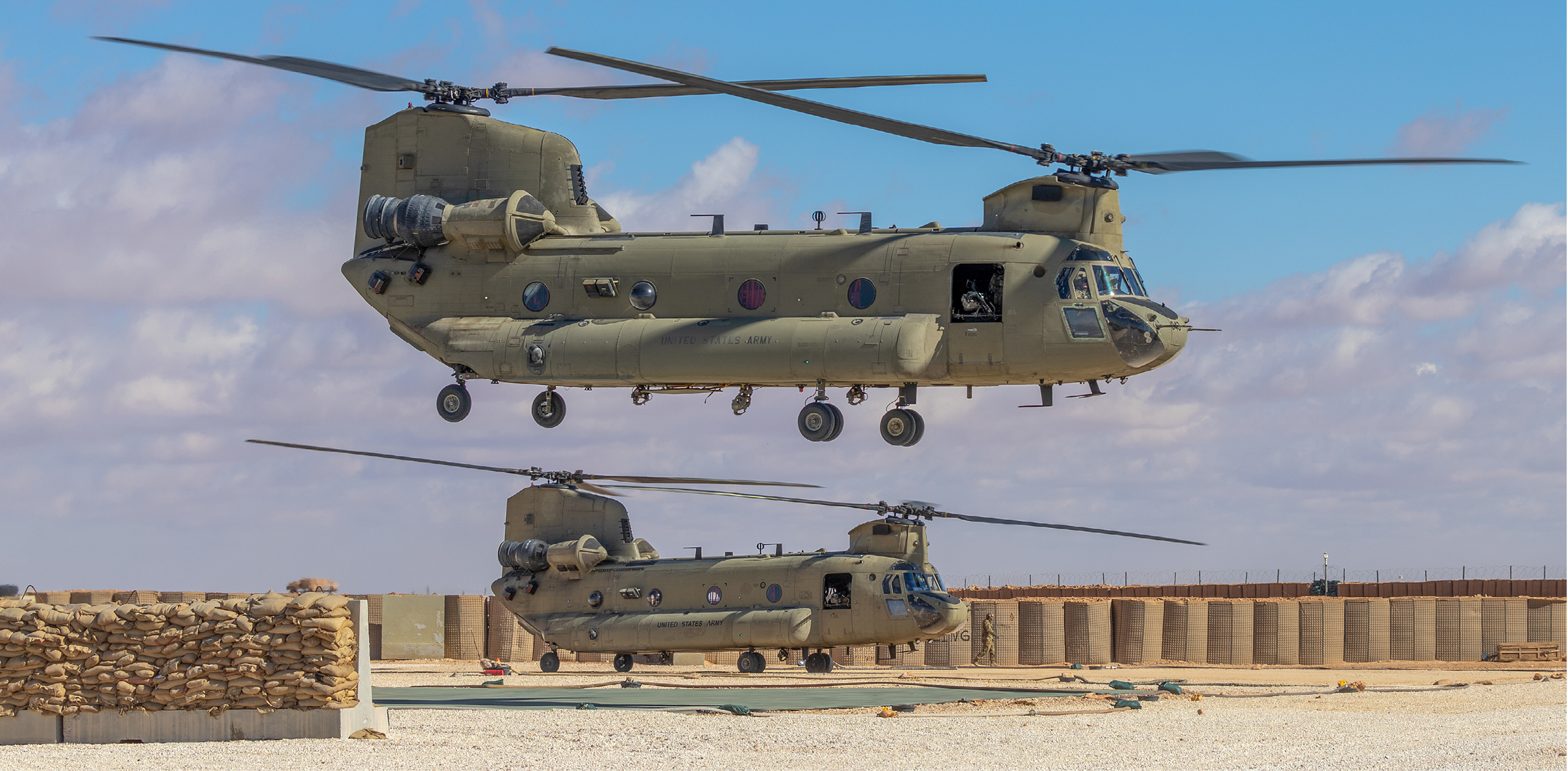 U.S. Army CH-47 Chinook helicopters with 7th General Support Aviation Brigade, 11th Combat Aviation Brigade (CAB) take off for a mission in the U.S. Central Command area of operations, Jan. 29, 20222. 11th CAB, mobilized as Task Force Eagle, is deployed in support of the Combined Joint Task Force – Operation Inherent Resolve mission to advise, assist and enable partnered forces in the enduring defeat of Da’esh, the common Arabic term for IS or ISIS, within designated areas of Iraq and Syria. (U.S. Army photo by Sgt. Steven Lewis) (Portions of this photo have been blurred for security reasons.)
