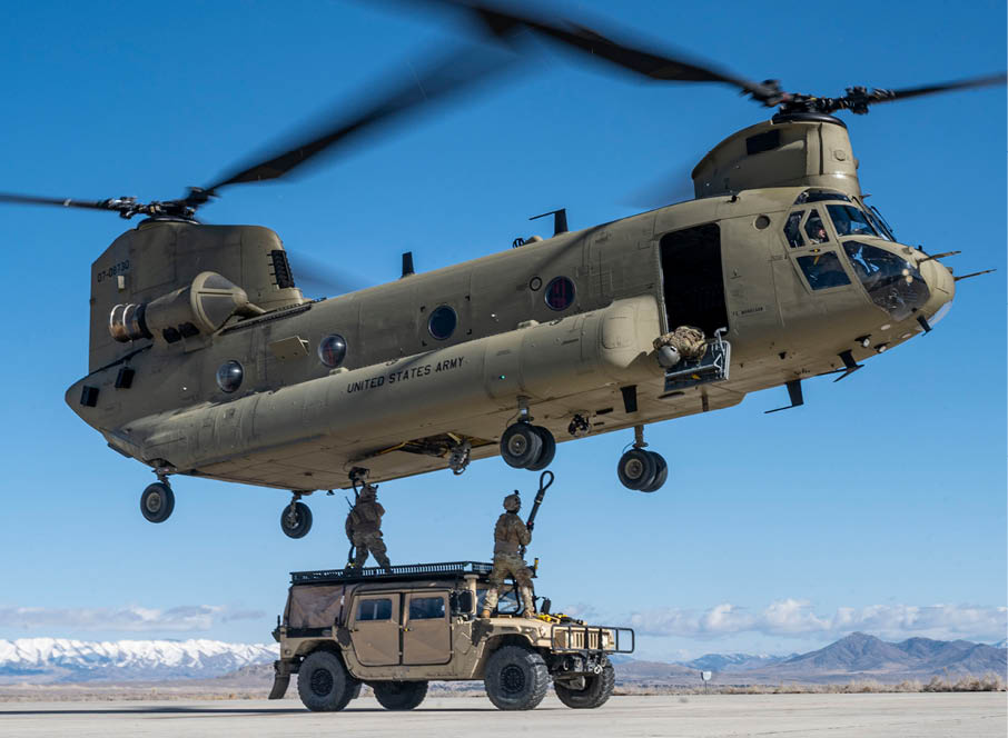 U.S. Air Force 521st Contingency Response Squadron Airmen conduct sling load training with a Humvee onto a CH-47 Chinook assigned to the 2nd Battalion, 135th Aviation Regiment during exercise Emerald Warrior 24, at Dugway Proving Ground, March 8, 2024. Emerald Warrior provides annual realistic, relevant, high-end pre-deployment training in a complex and evolving security environment using all aspects of live, virtual and constructive training assets. (U.S. Air Force photo by Staff Sgt. Aaron Irvin)
