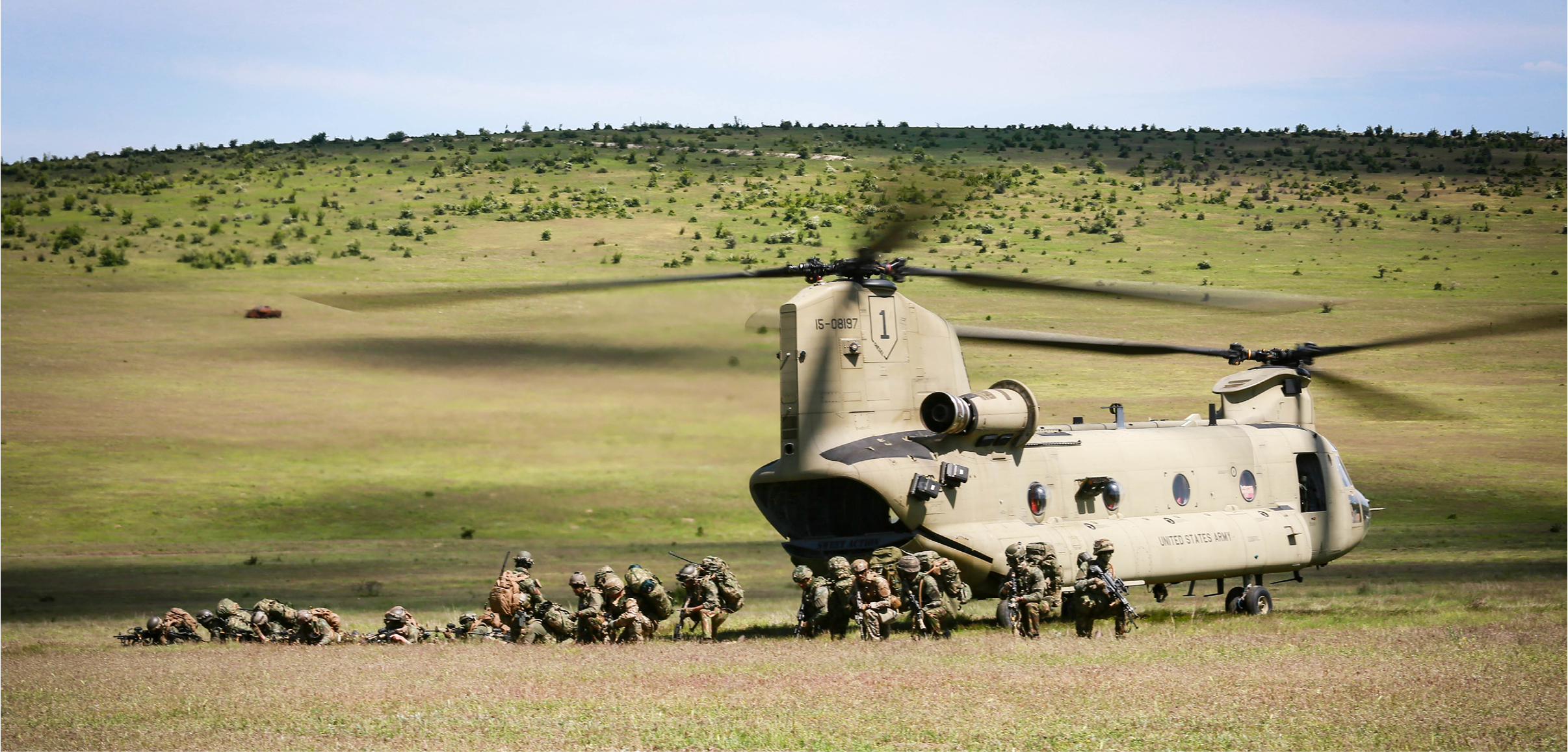 A CH-47 Chinook cargo helicopter transports joint forces and equipment during Swift Response 21 in Babadag training area, Romania, May 14, 2021. Swift Response 21 is a Defender 21 linked exercise, an annual large-scale US Army-led, multinational, joint exercise designed to build readiness and interoperability between US, NATO, and partner militaries. (U.S. Army photo by Sgt. Audrequez Evans)