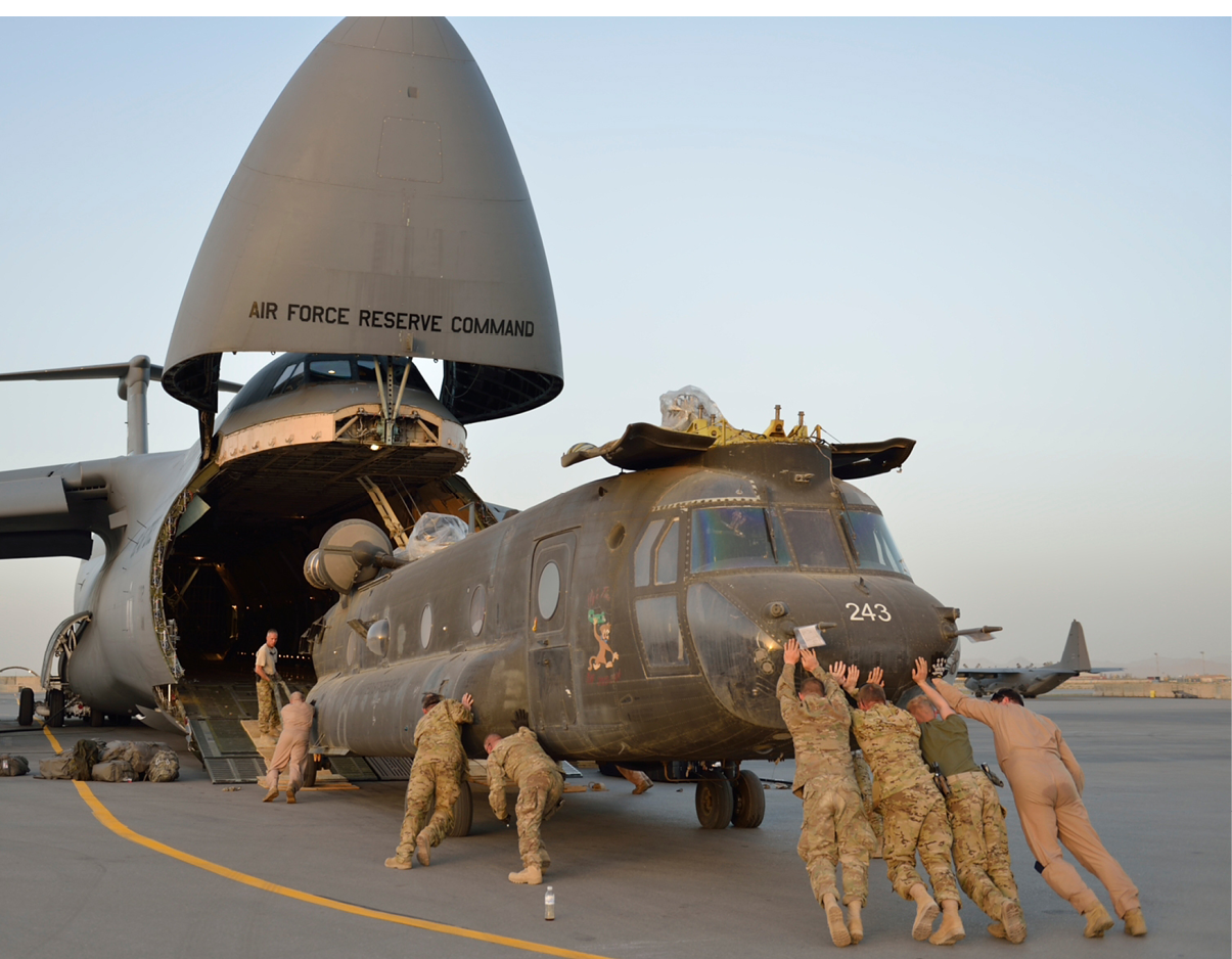 U.S. Soldiers assigned to Detachment 1, Bravo Company, 3rd Battalion, 126th Aviation (Heavy Lift), New York Army National Guard, load CH-47 Chinook helicopters onto a C-5 Galaxy as they prepare to return home to the United States following a nine-month deployment in Kandahar province, Afghanistan, April 20, 2013. (U.S. Army National Guard photo by 1st Lt. Benjamin J. Postle/Released)