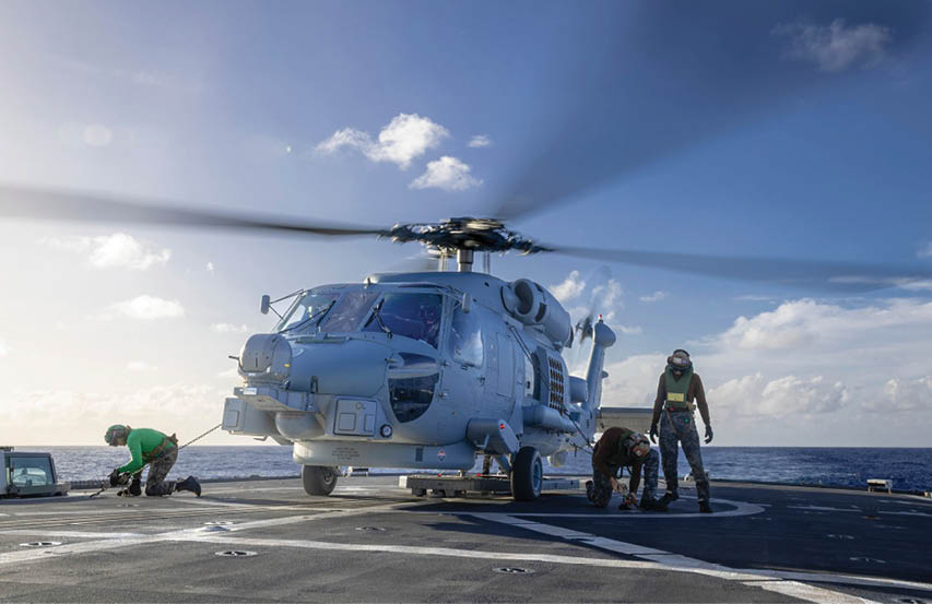 HMAS Arunta's flight deck team secures the embarked MH60-R, following a mission off the east coast of Australia. *** Local Caption *** As part of Australia�s whole-of-government commitment to maritime border protection, Defence monitors all maritime traffic in our Exclusive Economic Zone and maritime approaches.  Australia respects the right of all countries under international law to exercise freedom of navigation and overflight in international waters and airspace, just as we expect others to respect o