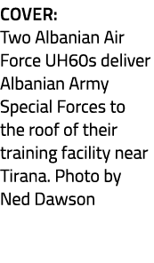 Cover: Two Albanian Air Force UH60s deliver Albanian Army Special Forces to the roof of their training facility near ...