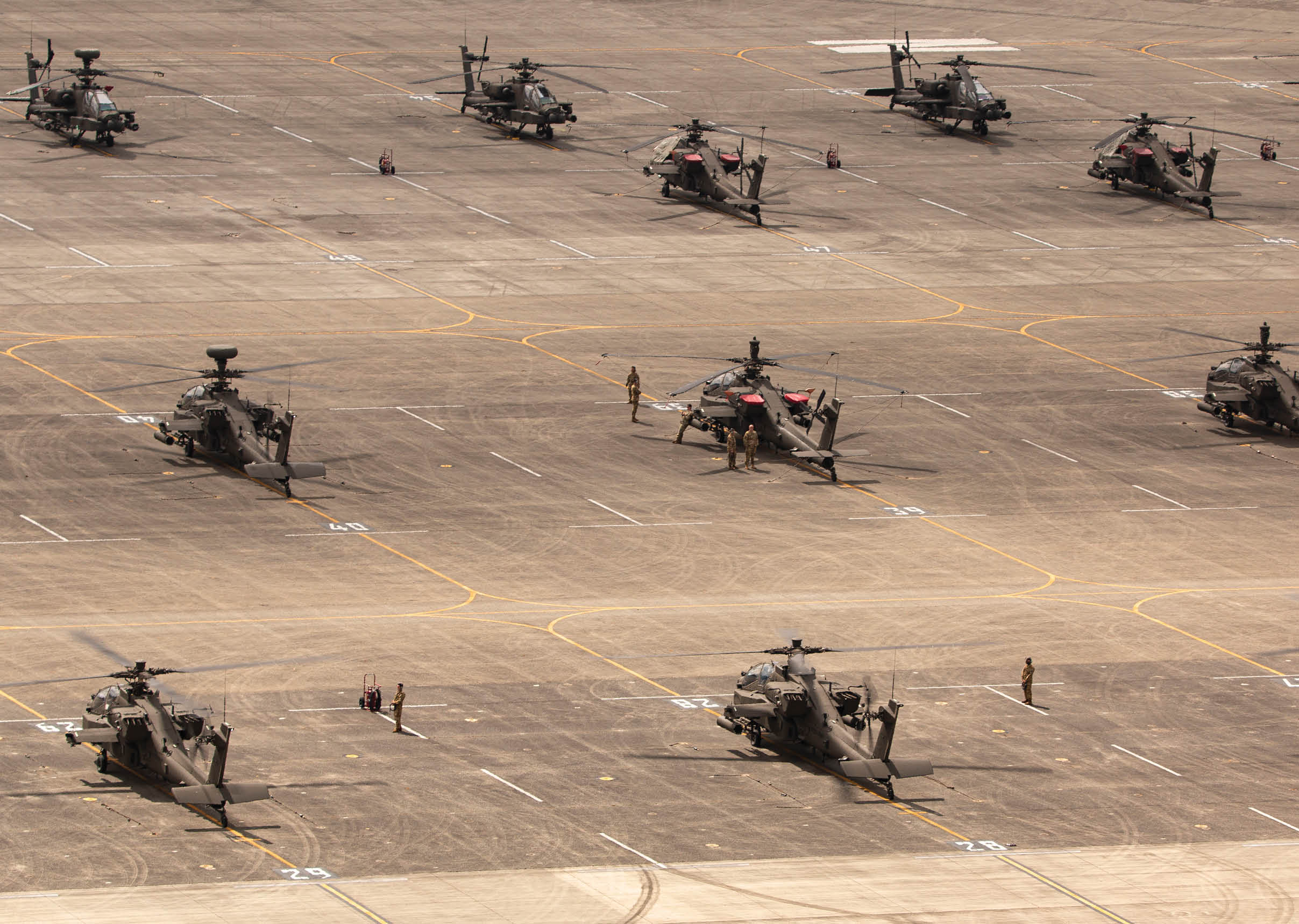 Aviation Soldiers assigned to 1-229th Assault Reconnaissance Battalion, 16th Combat Aviation Brigade conduct an Emergency Deployment Readiness Exercise to demonstrate the abilities of the new AH-64E version 6 Apache helicopters on Joint Base Lewis-McChord, Wash., April 22, 2021. The “Tiger Shark” battalion is the first operational unit in the Army to receive the V6, the most advanced combat helicopter to date. (U.S. Army National Guard photo by Sgt. Adeline Witherspoon, 122nd Public Affairs Operations Center)
