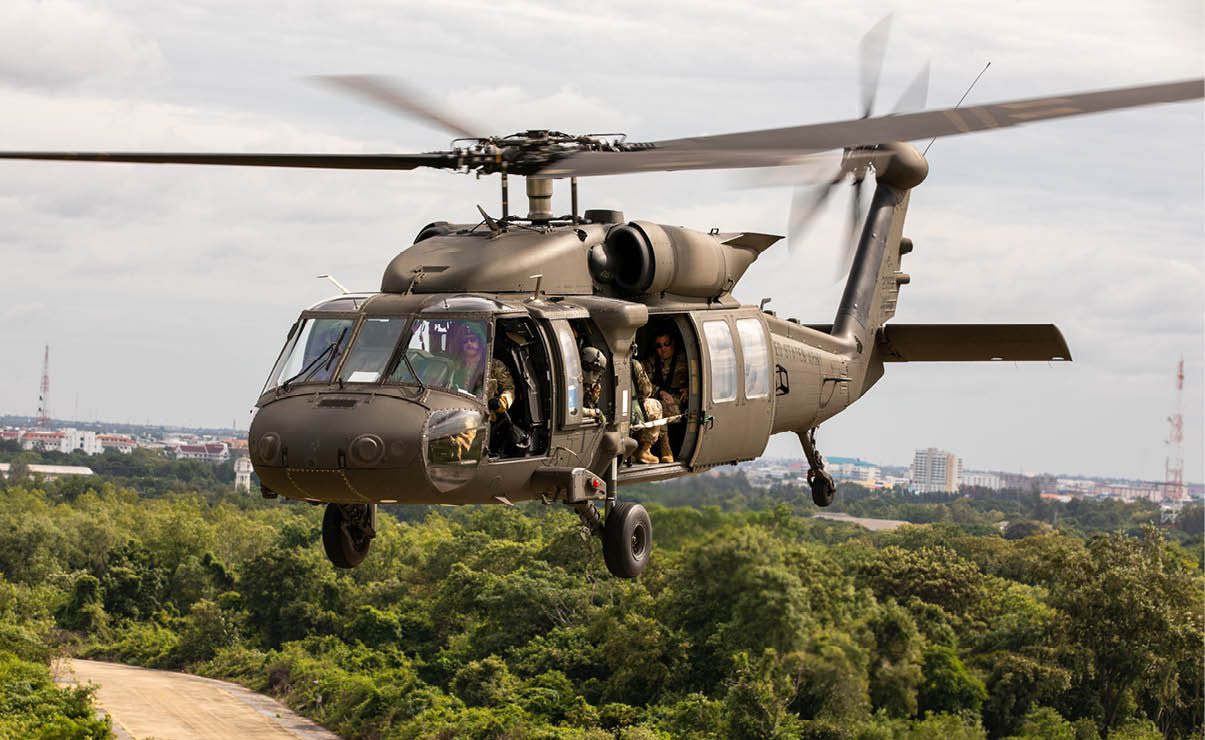 A Washington Army National Guard UH-60M Black Hawk, assigned to the 96th Aviation Troop Command, conducts a training flight as part of Enduring Partners 2025 over Korat Royal Thai Air Force Base, Thailand, Aug. 26, 2025. Enduring Partners is an exchange that builds joint readiness by integrating U.S. and Thai forces in mission areas including ground-controlled interception, cyber, humanitarian aid and disaster relief, tactical air control party and space. (U.S. Army National Guard photo by Sgt. Matthew Sprowl)