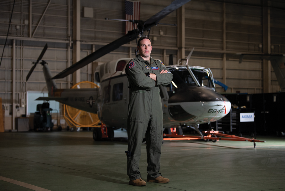 U.S. Air Force Maj. Michael Girolami, 459th Airlift Squadron director of operations, stands in front of a UH-1N Huey at Yokota Air Base, Japan, Sept. 5, 2025. The UH-1N first arrived at Yokota in 1980, and for over 45 years, the aircraft supported a wide range of missions across the region, including aeromedical evacuations and the transport of senior government officials. It also played a critical role in Operation Tomodachi following the Great East Japan Earthquake of 2011, conducting reconnaissance flights and low-level radiation mapping in the aftermath of the Fukushima Daiichi Nuclear Plant disaster. (U.S. Air Force photo by Staff Sgt. Natalie Doan)