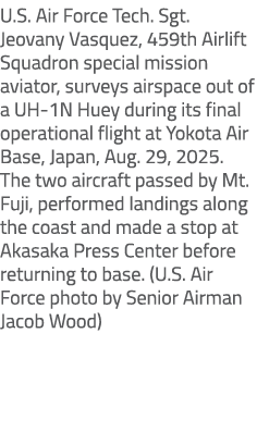 U.S. Air Force Tech. Sgt. Jeovany Vasquez, 459th Airlift Squadron special mission aviator, surveys airspace out of a ...
